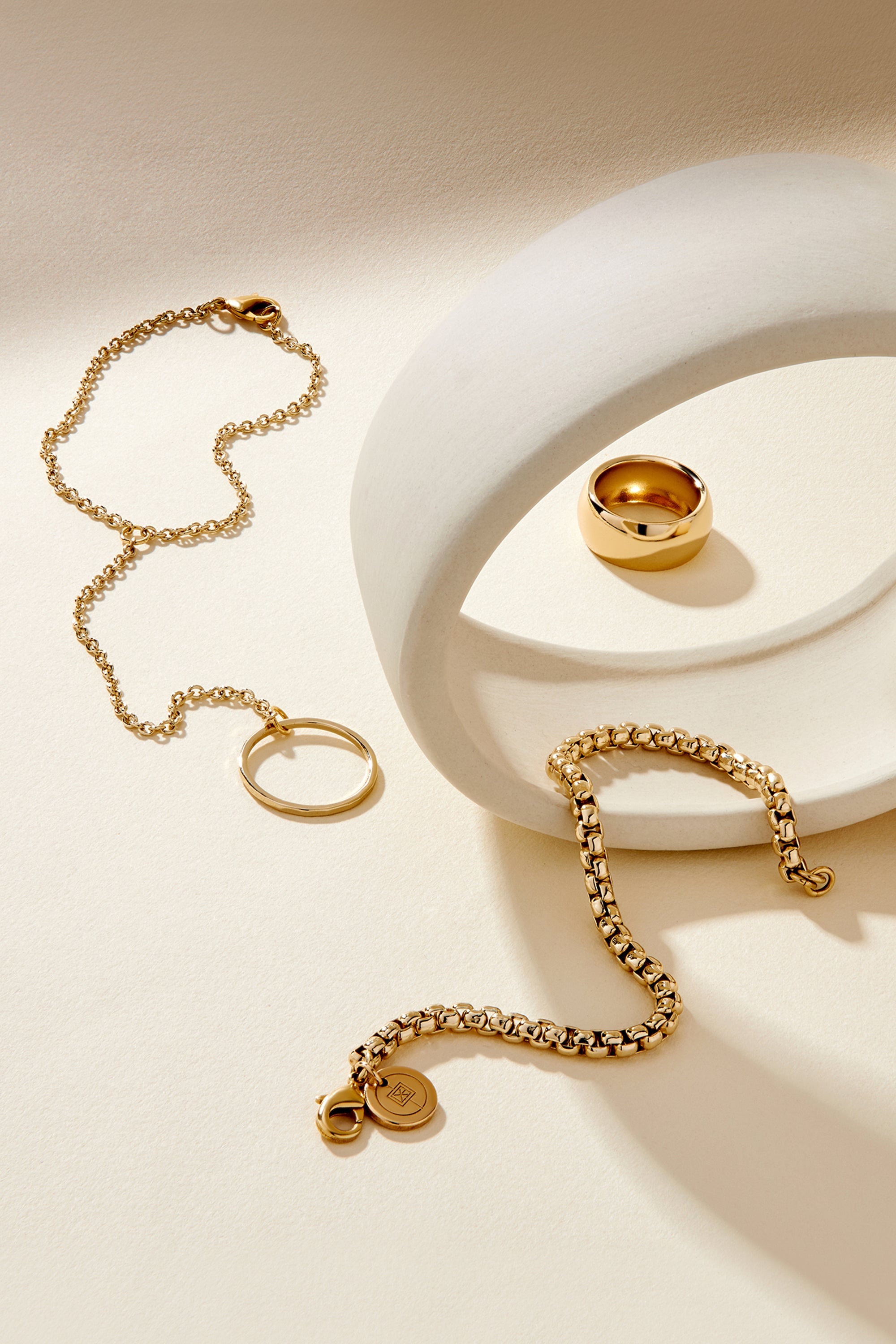 Gold-toned 14k yellow gold jewelry set featuring a 9.5mm Domed Ring with clear protective barrier