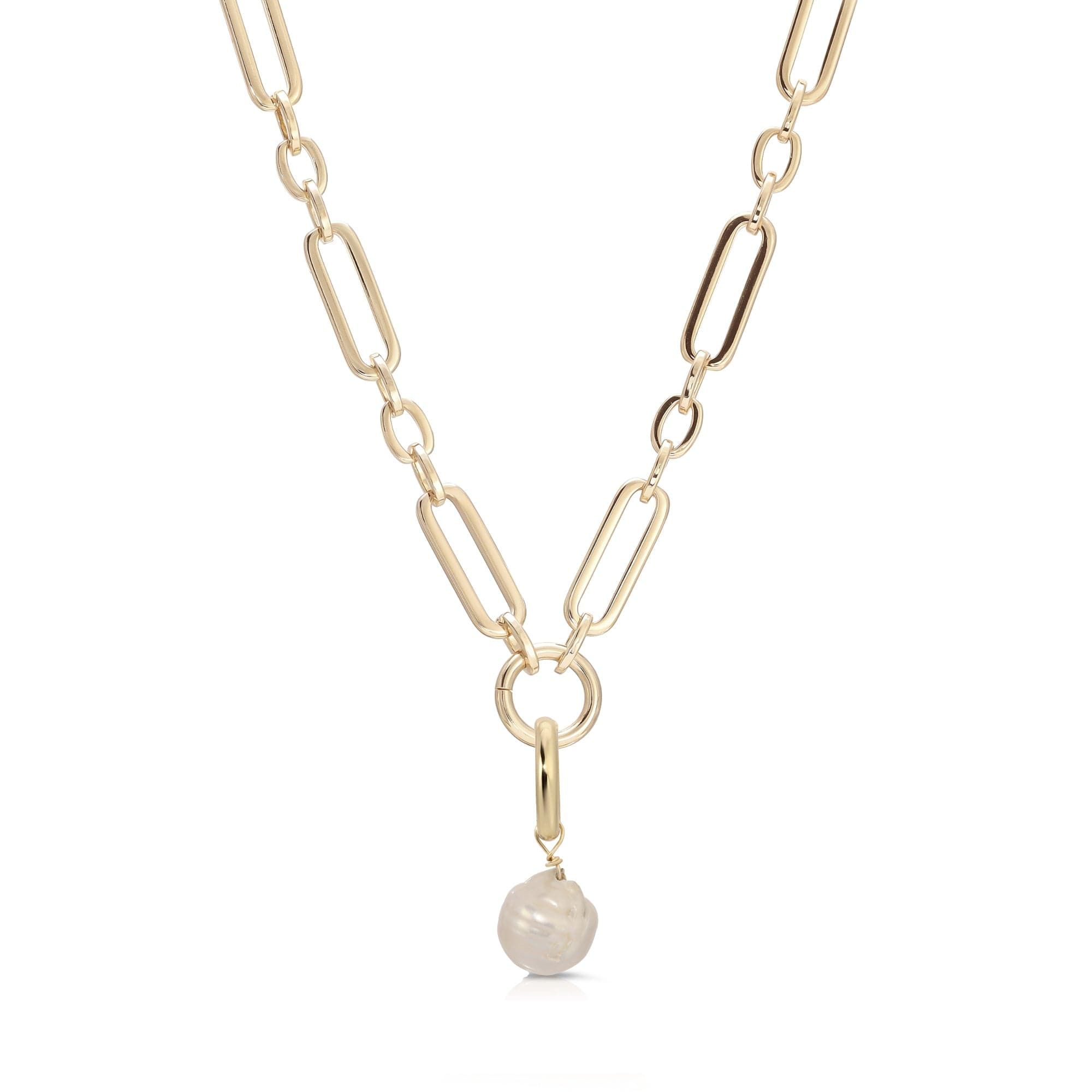 a gold chain with a white stone hanging from it
