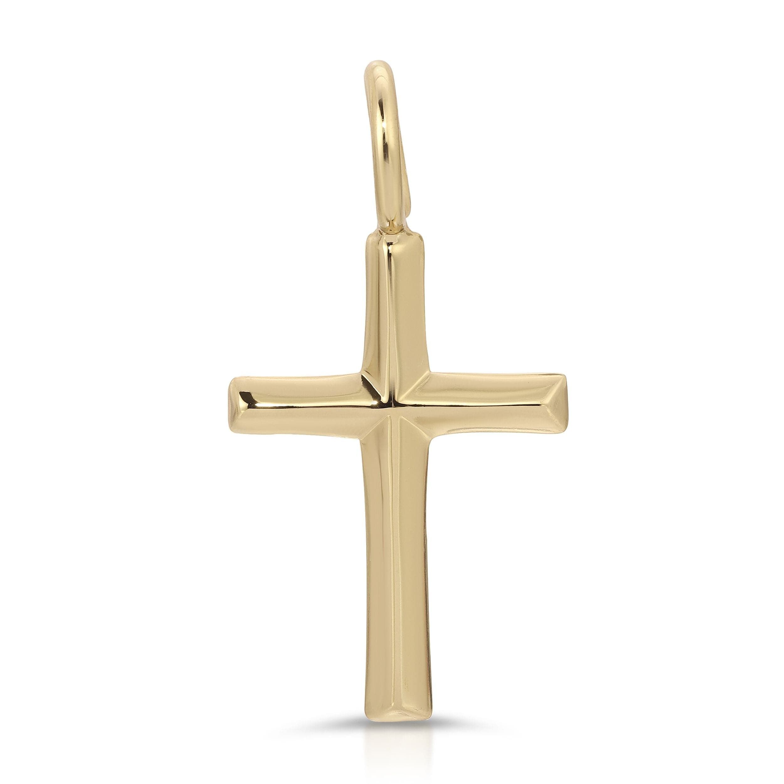 a gold cross pendant on a white background