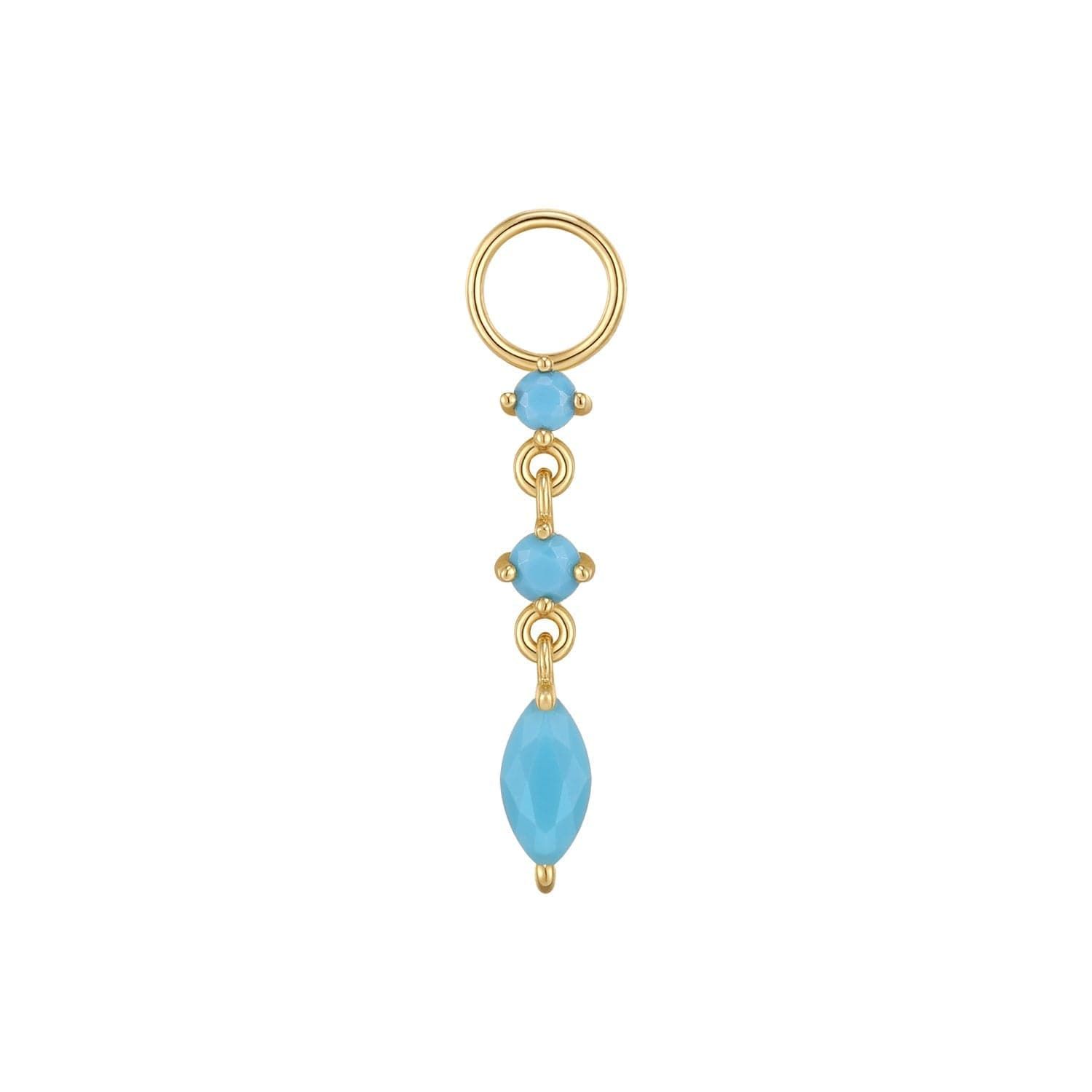 a pair of gold hoop earrings with blue stones