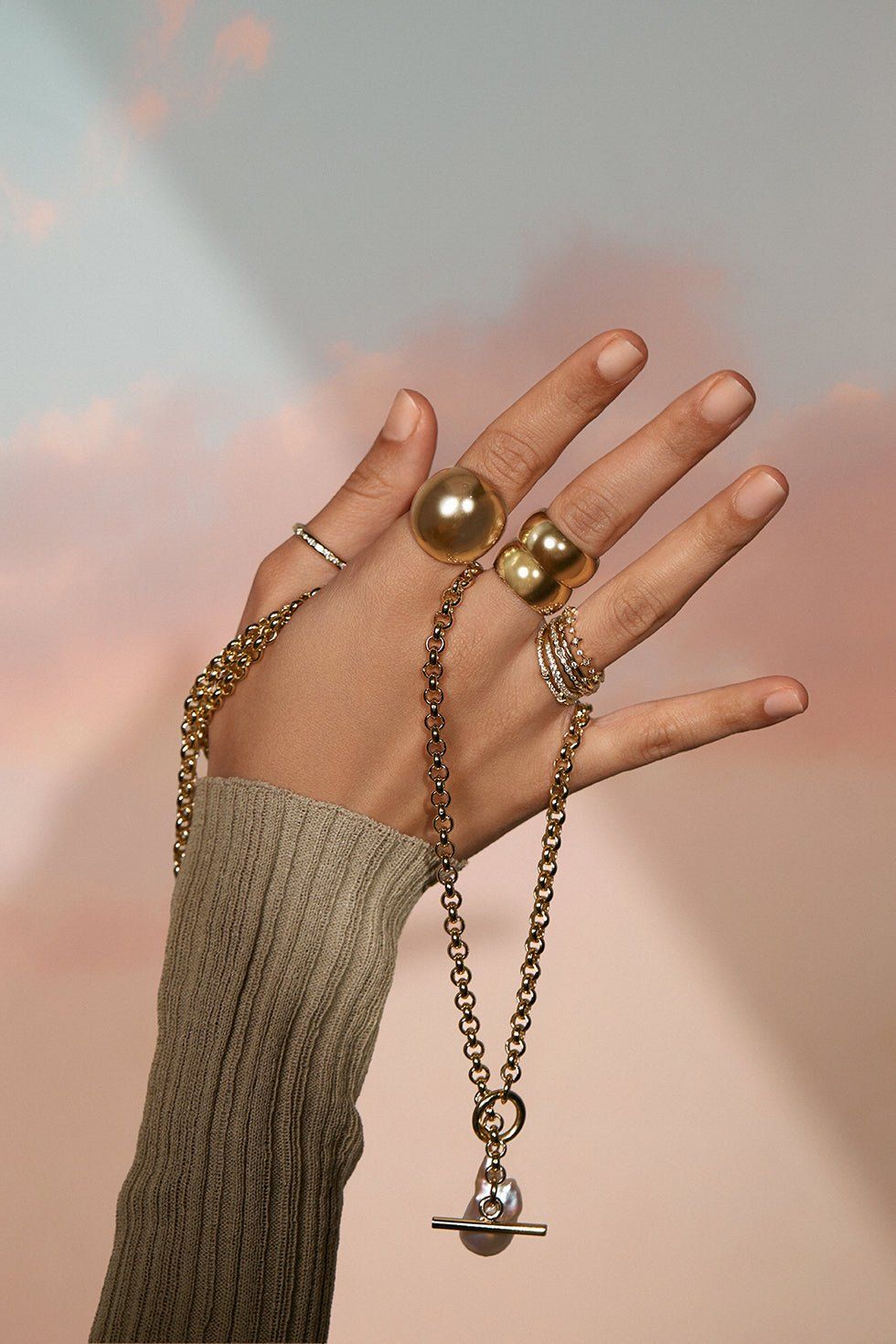 a woman's hand with two rings on it