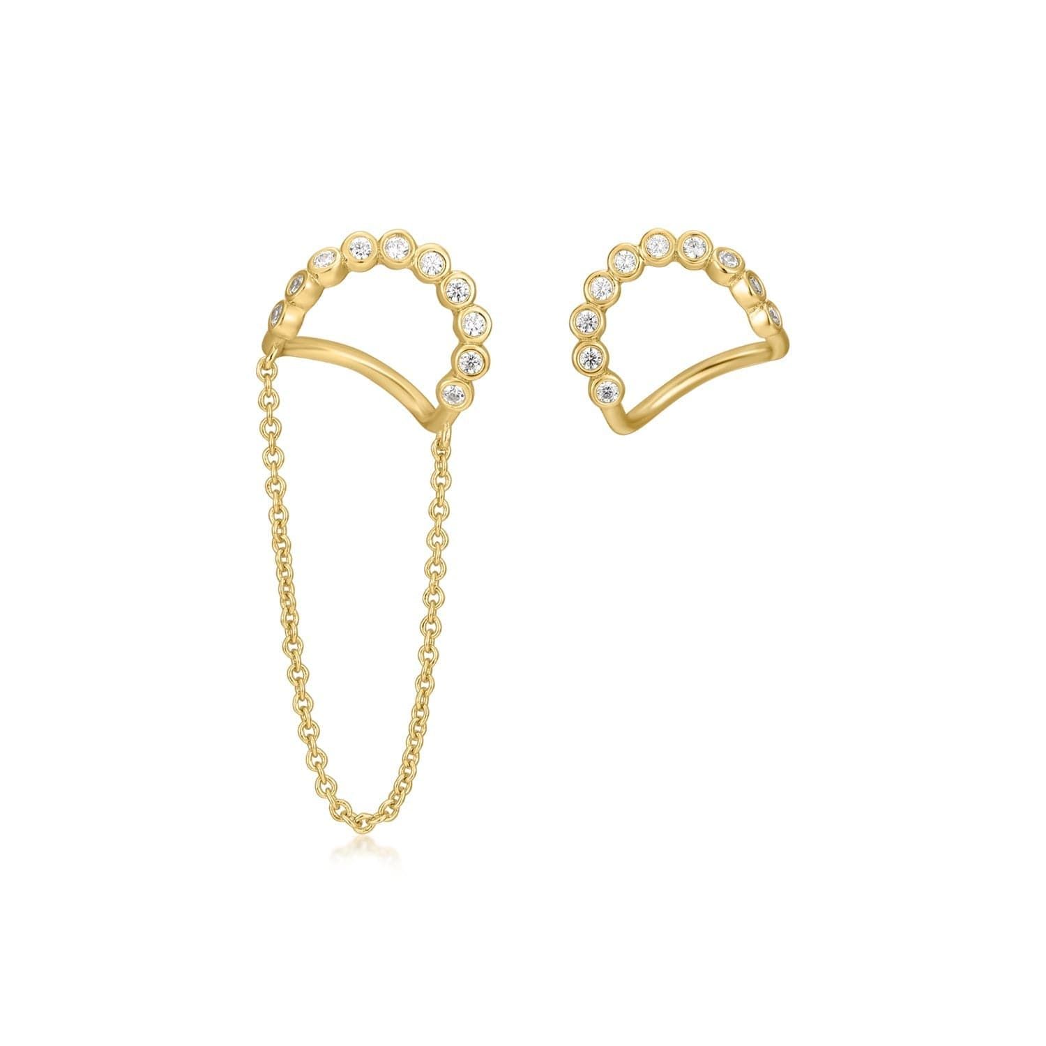 a pair of gold earrings with pearls
