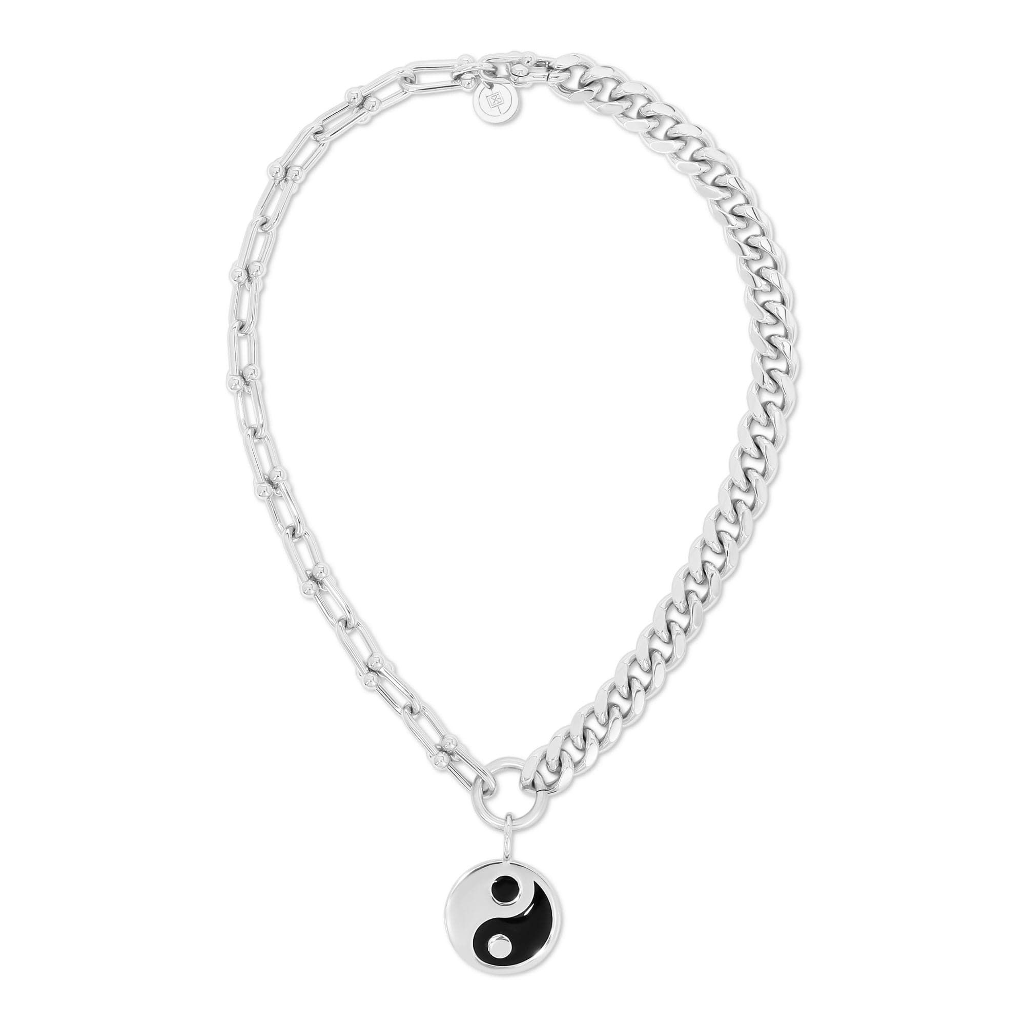 a silver chain bracelet with a yin symbol charm
