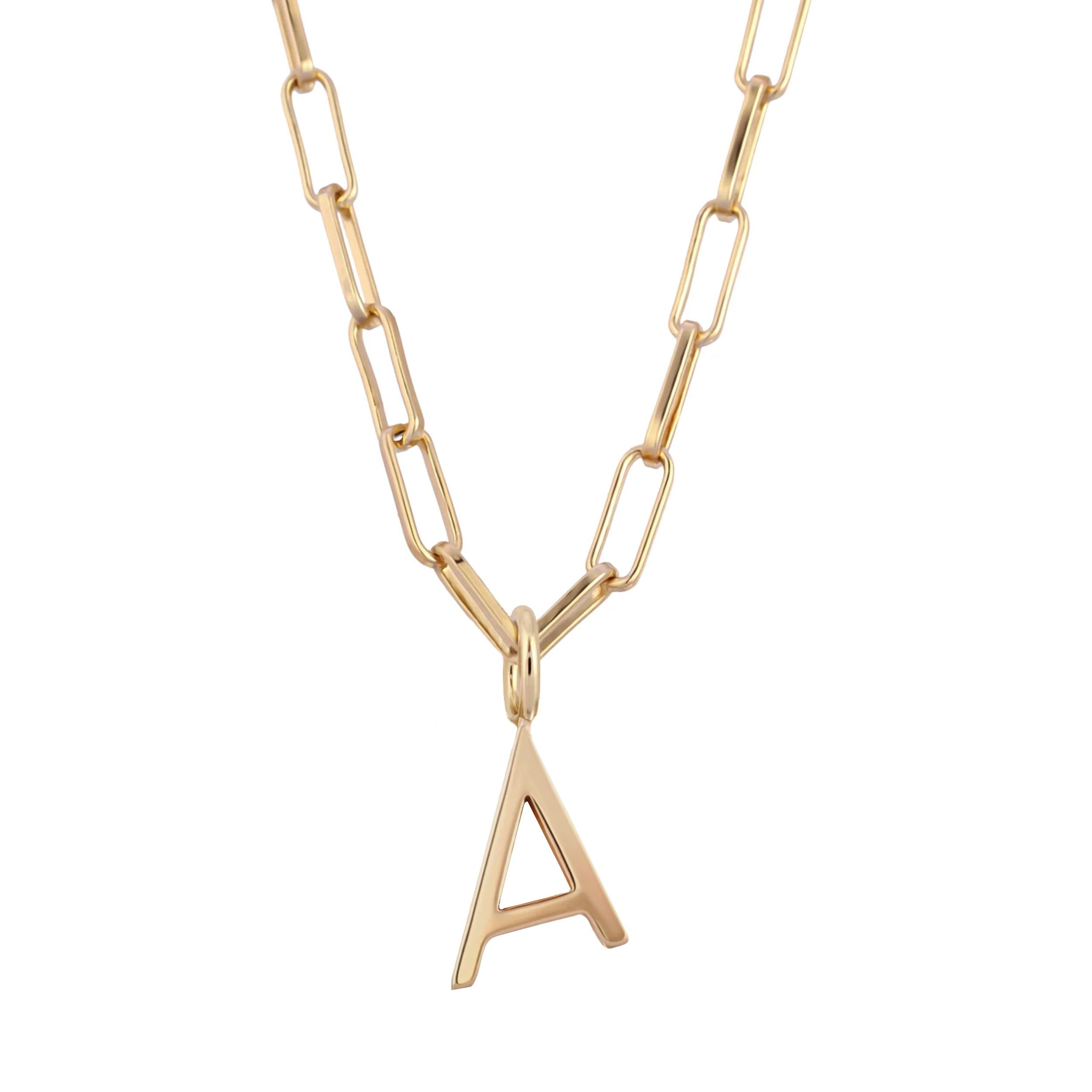 a gold chain necklace with a letter on it