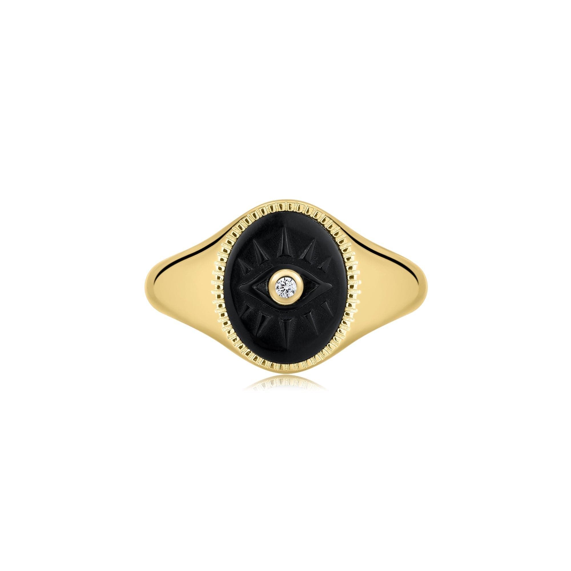 a gold ring with a black and white stone