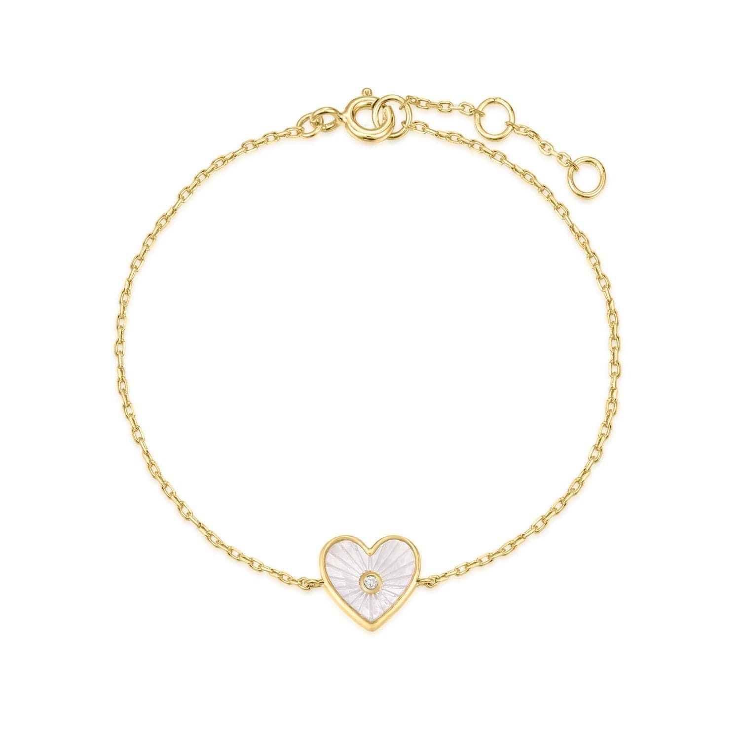 a gold bracelet with a heart shaped charm