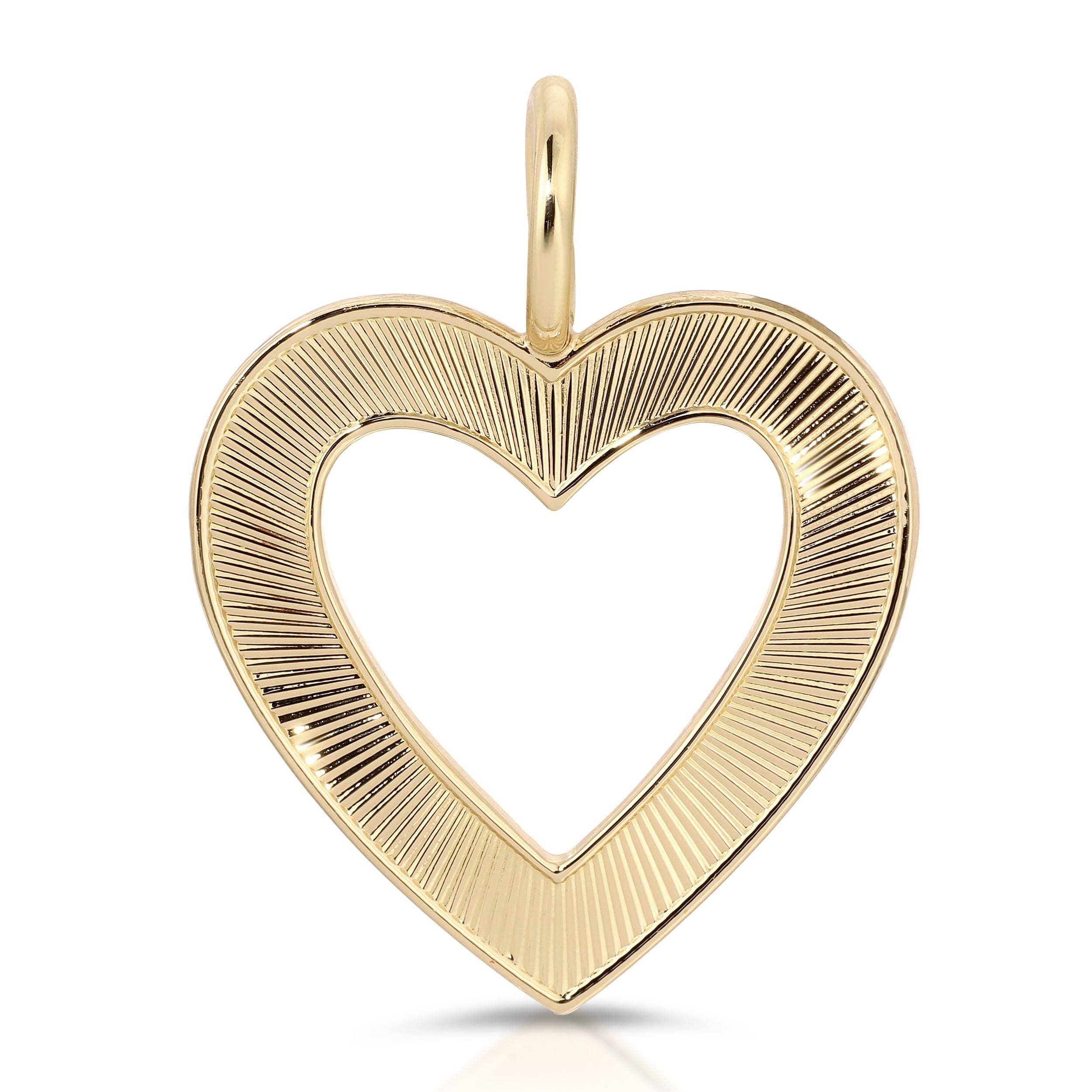 a gold heart pendant on a white background