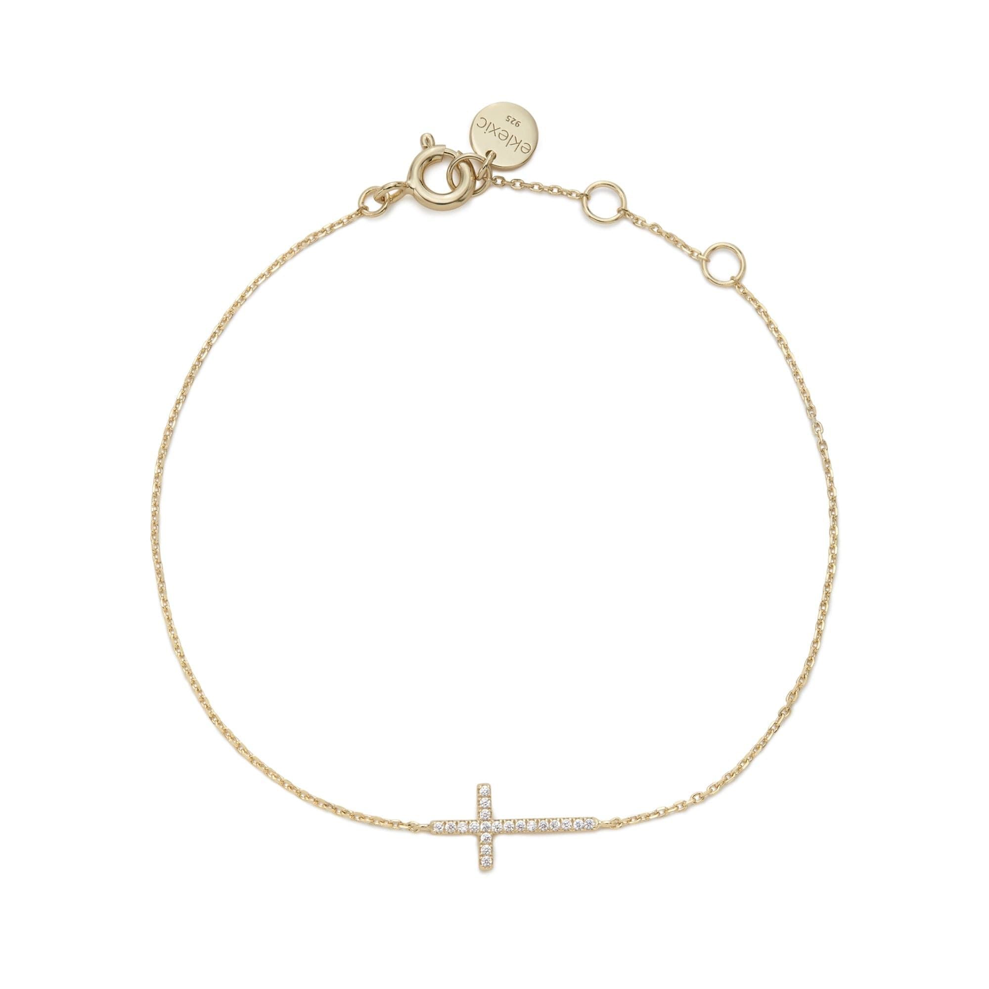 a gold bracelet with a cross on it