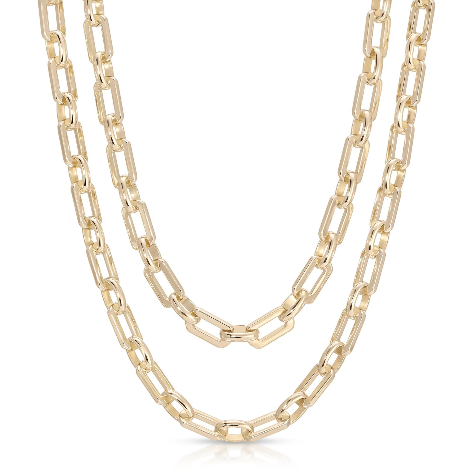 a long gold chain necklace on a white background