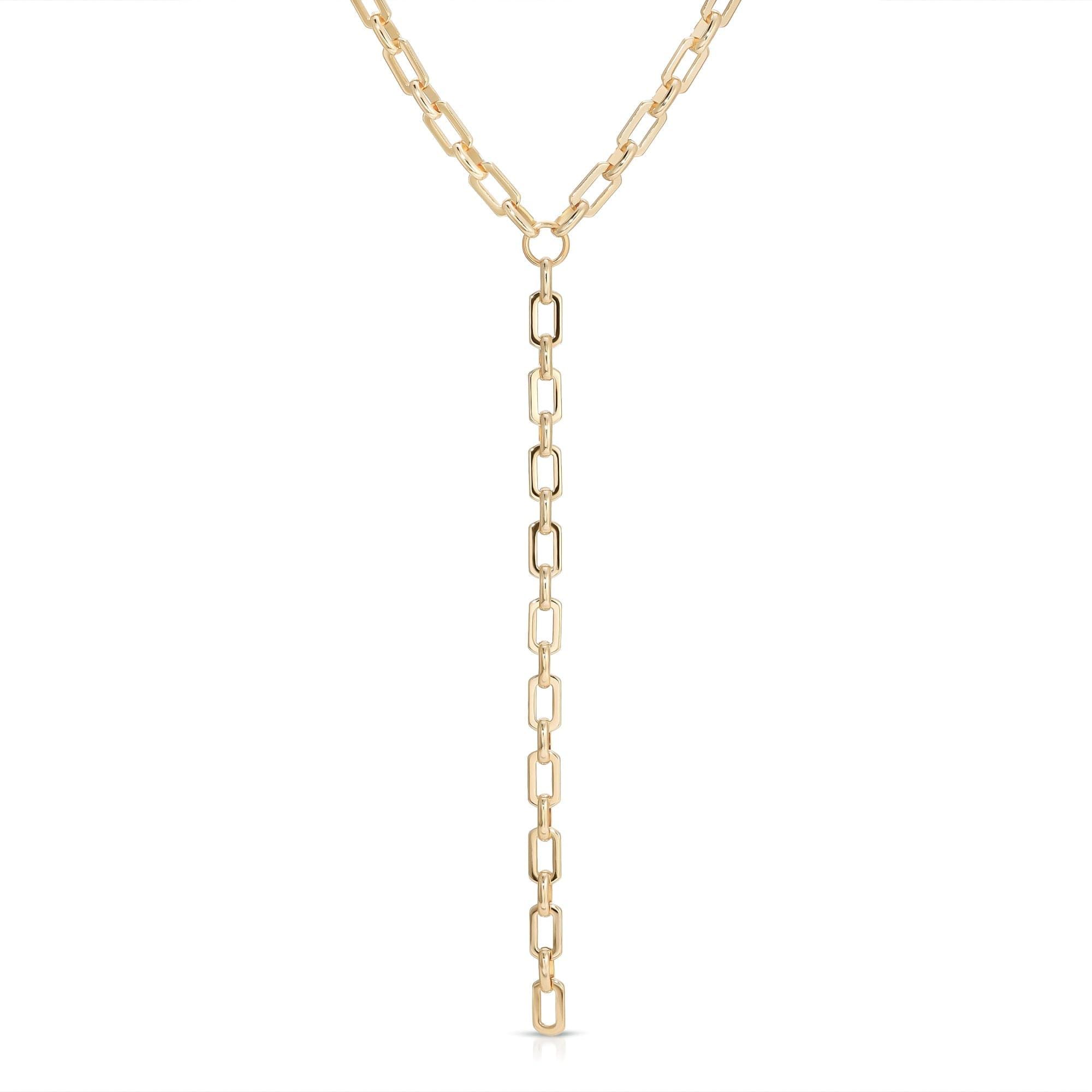 a gold necklace with a long chain on a white background