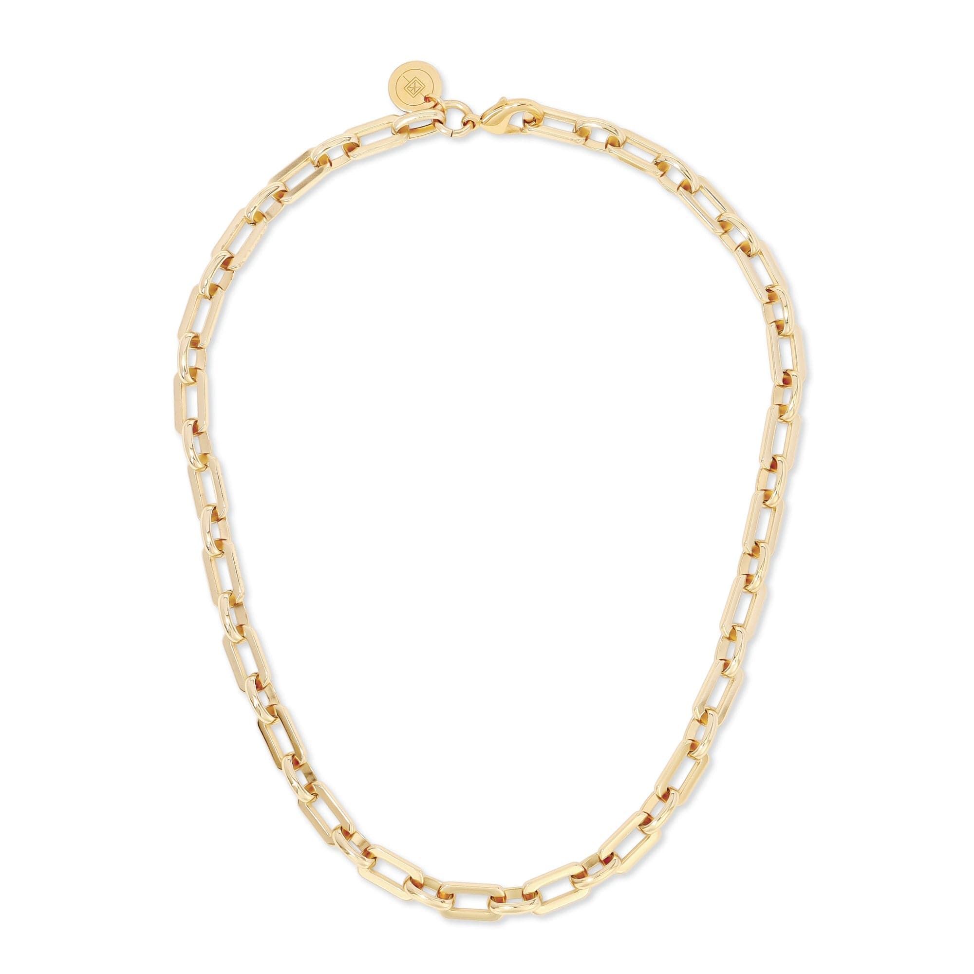 a gold chain necklace on a white background