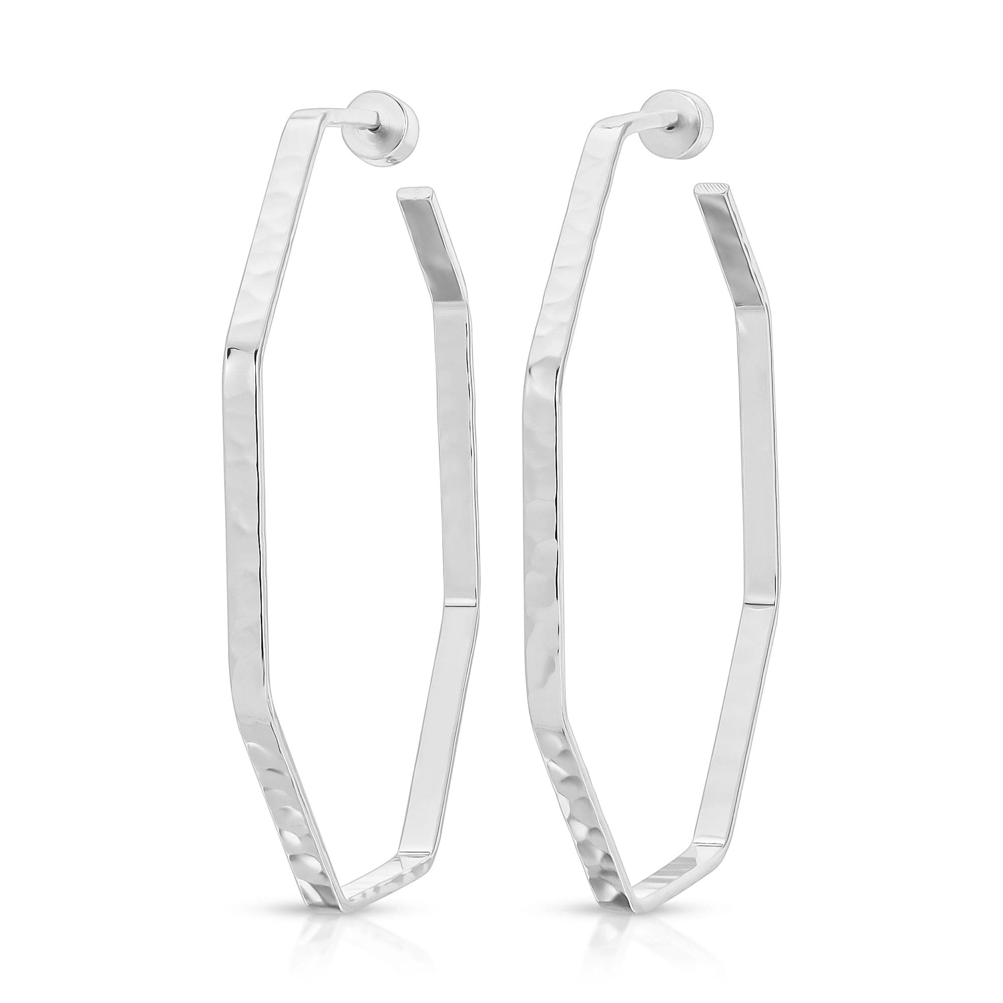 a pair of silver hoop earrings on a white background