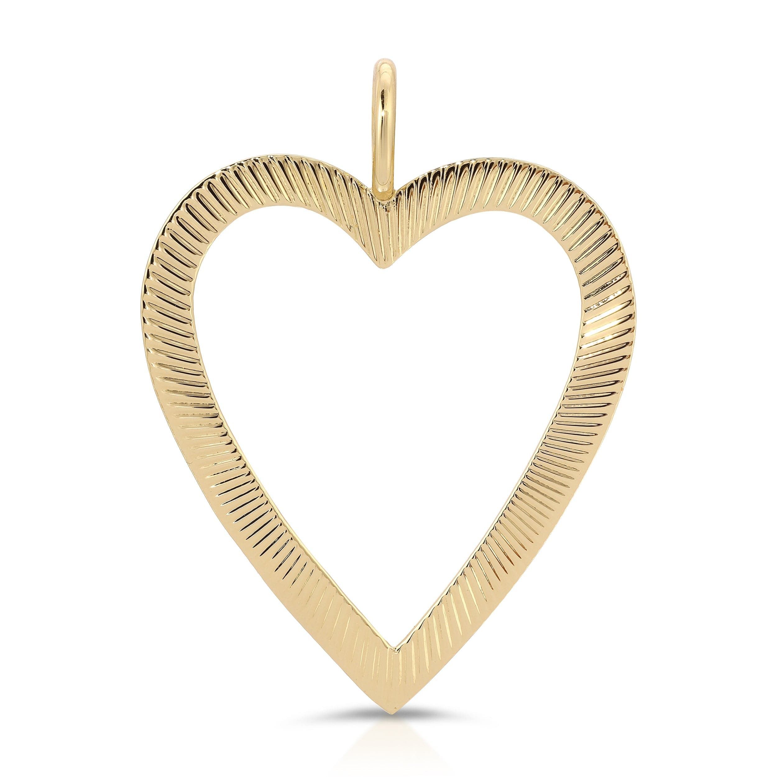 a gold heart shaped pendant on a white background