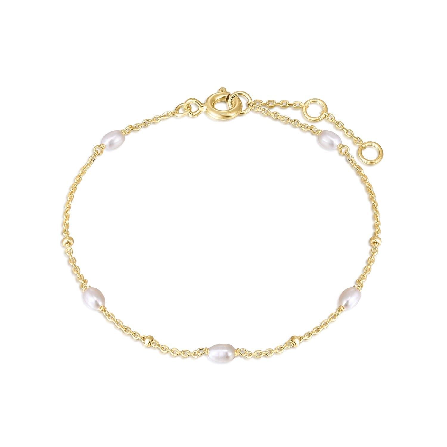 a gold chain bracelet with pearls
