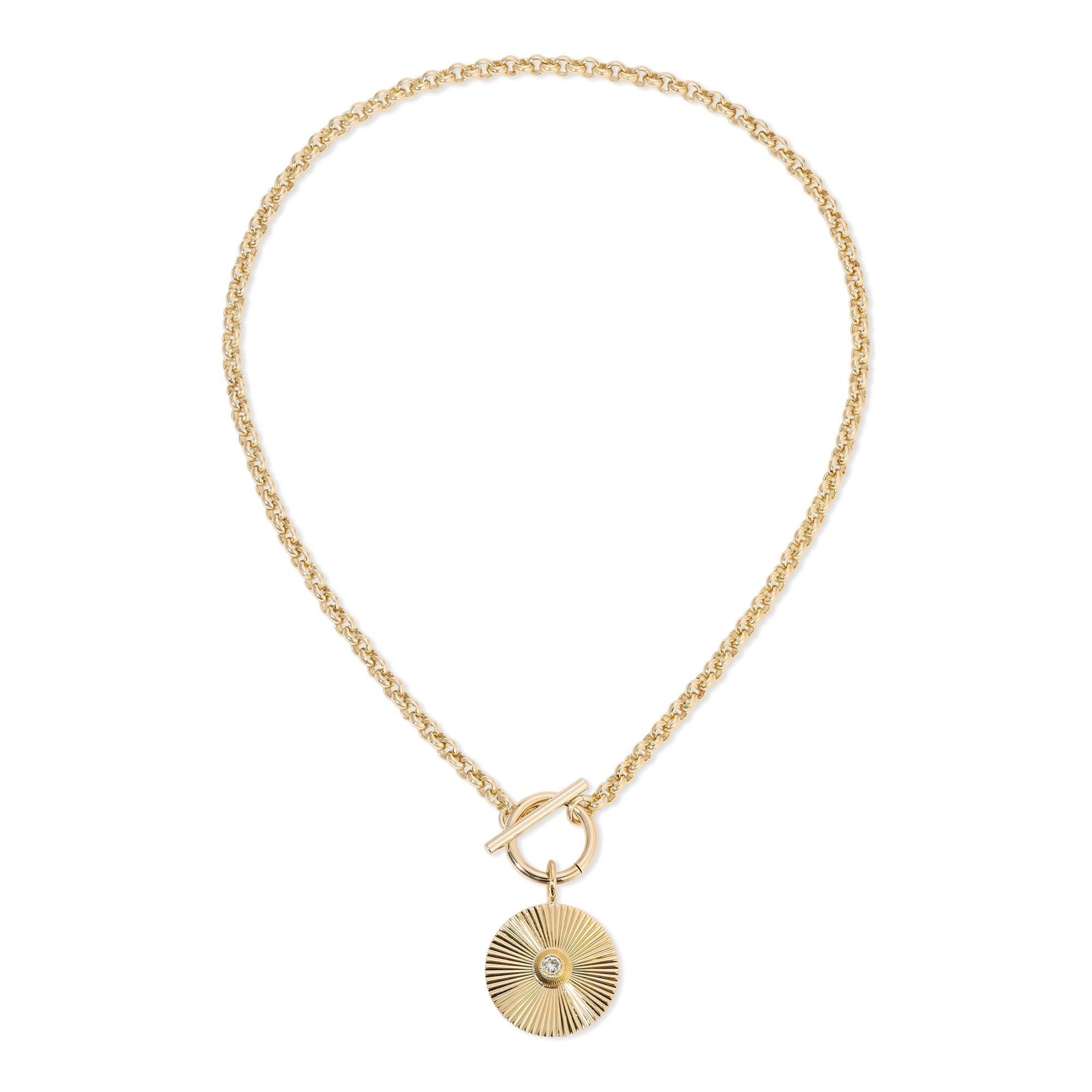 a gold necklace with a shell charm