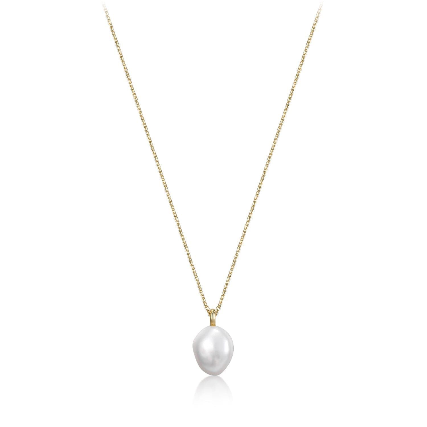 a white pearl necklace on a gold chain