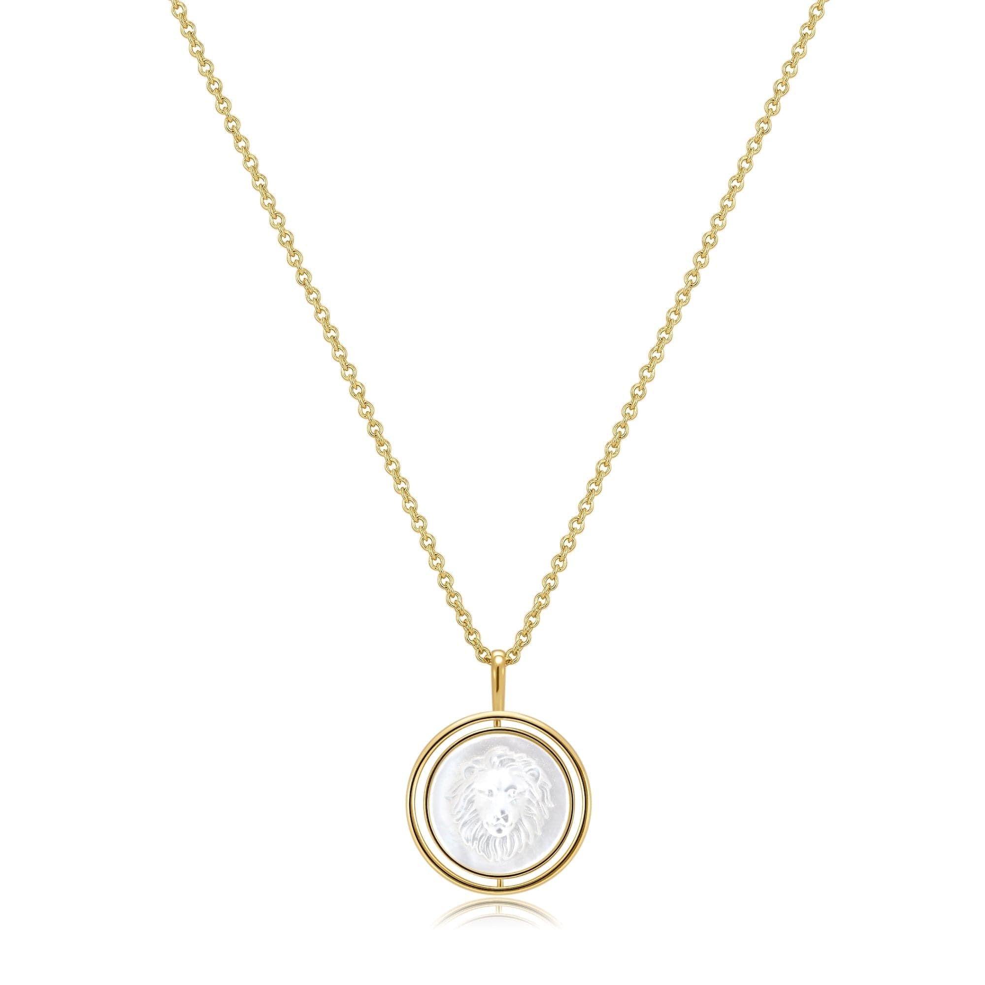 a gold necklace with a white stone in the center