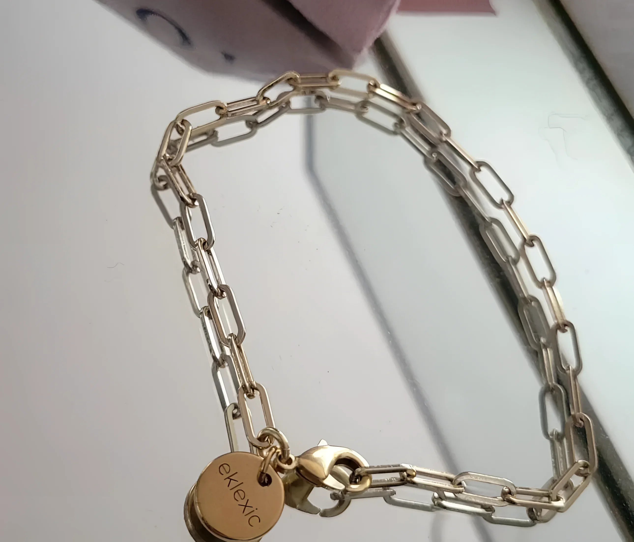 Gold chain-link bracelet with circular charm from Medium Link Chain Bracelet collection