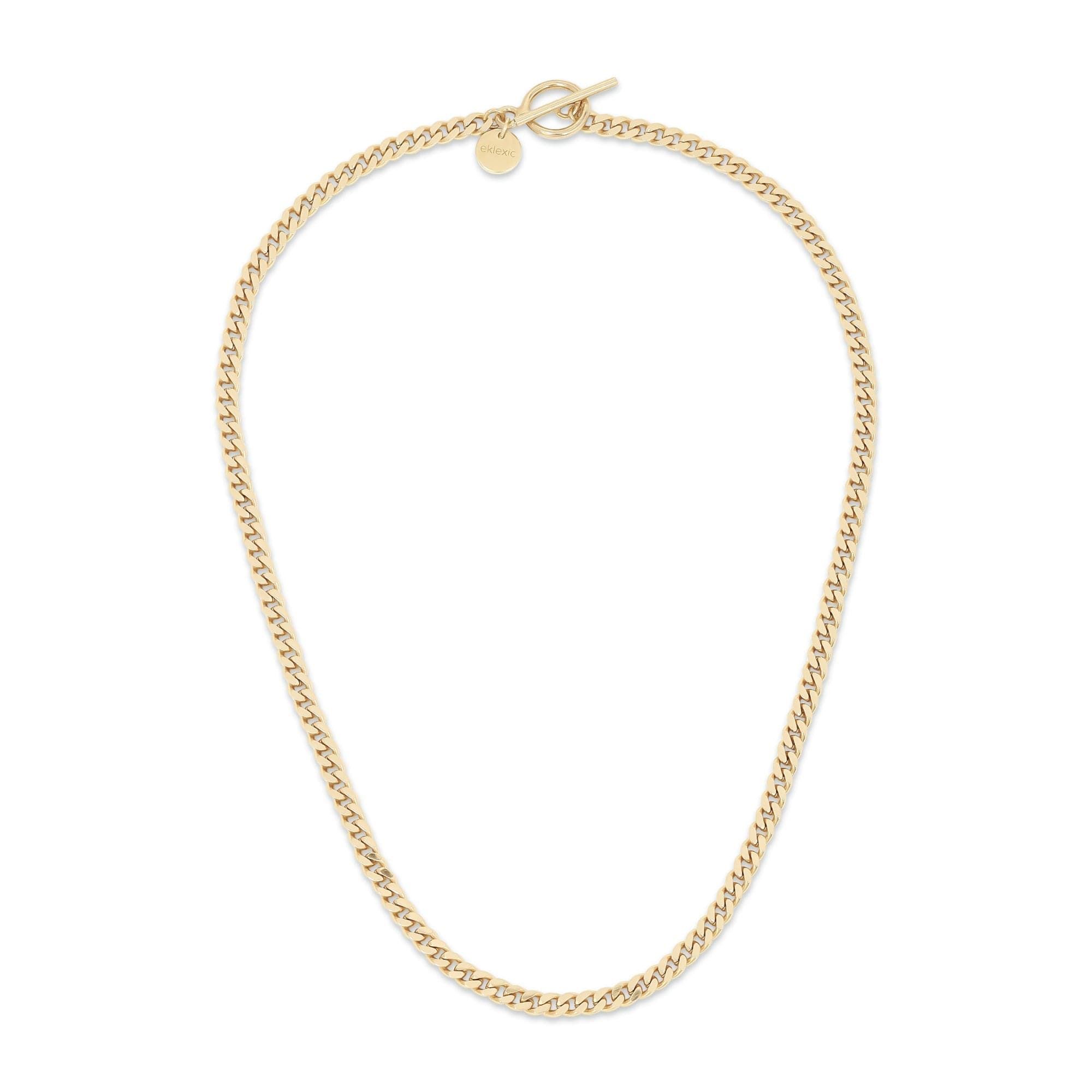 a gold necklace on a white background