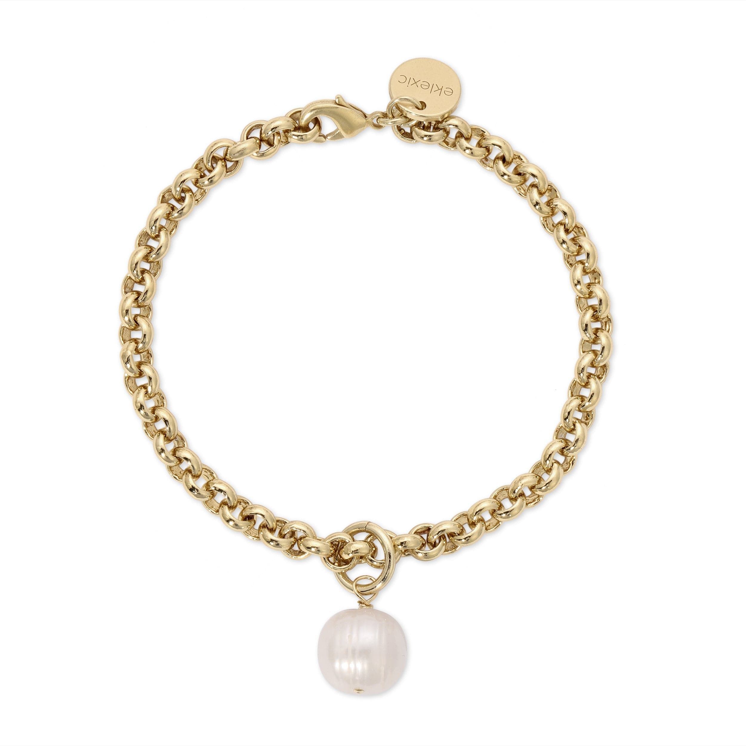 a gold bracelet with a pearl charm