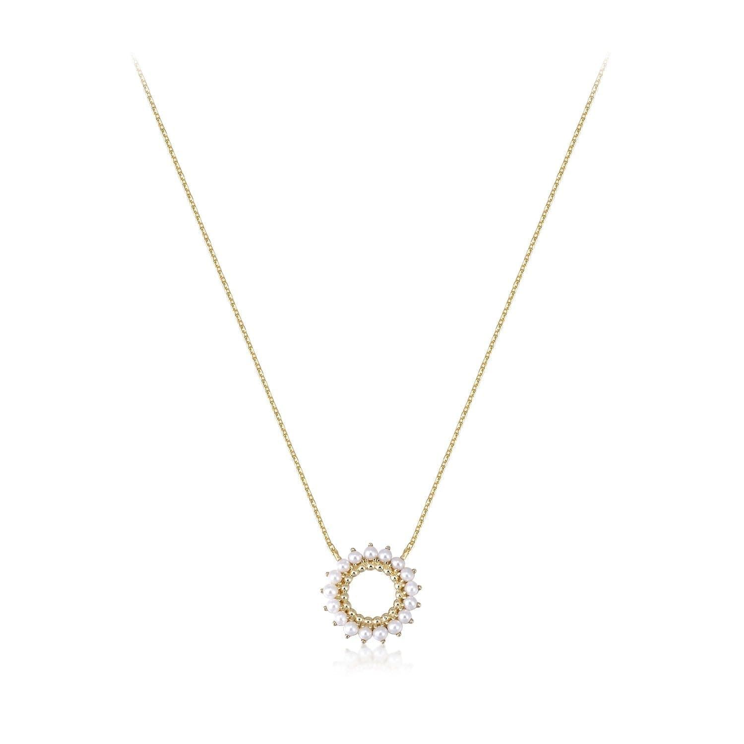 a gold necklace with a diamond circle