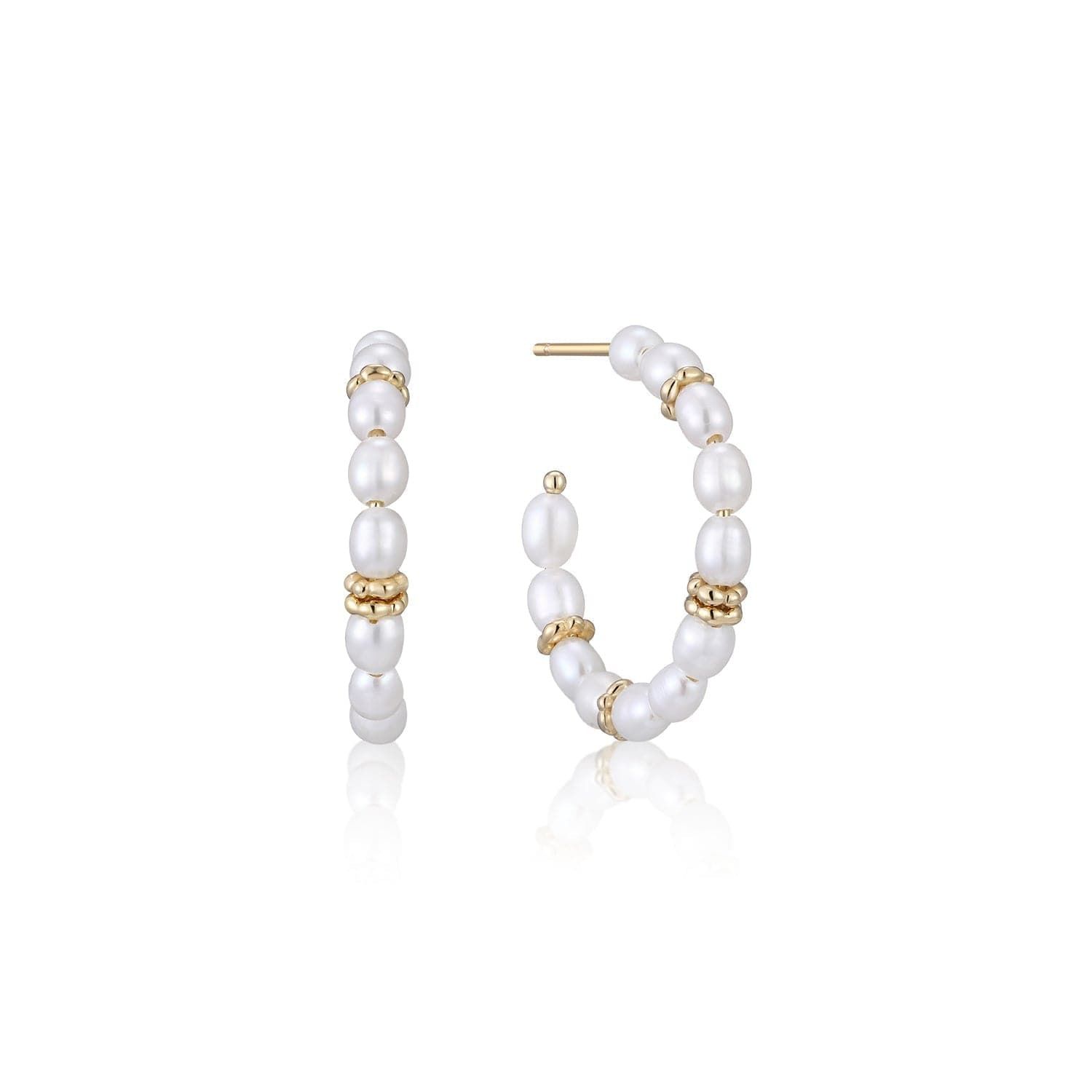 a pair of pearl and gold hoop earrings