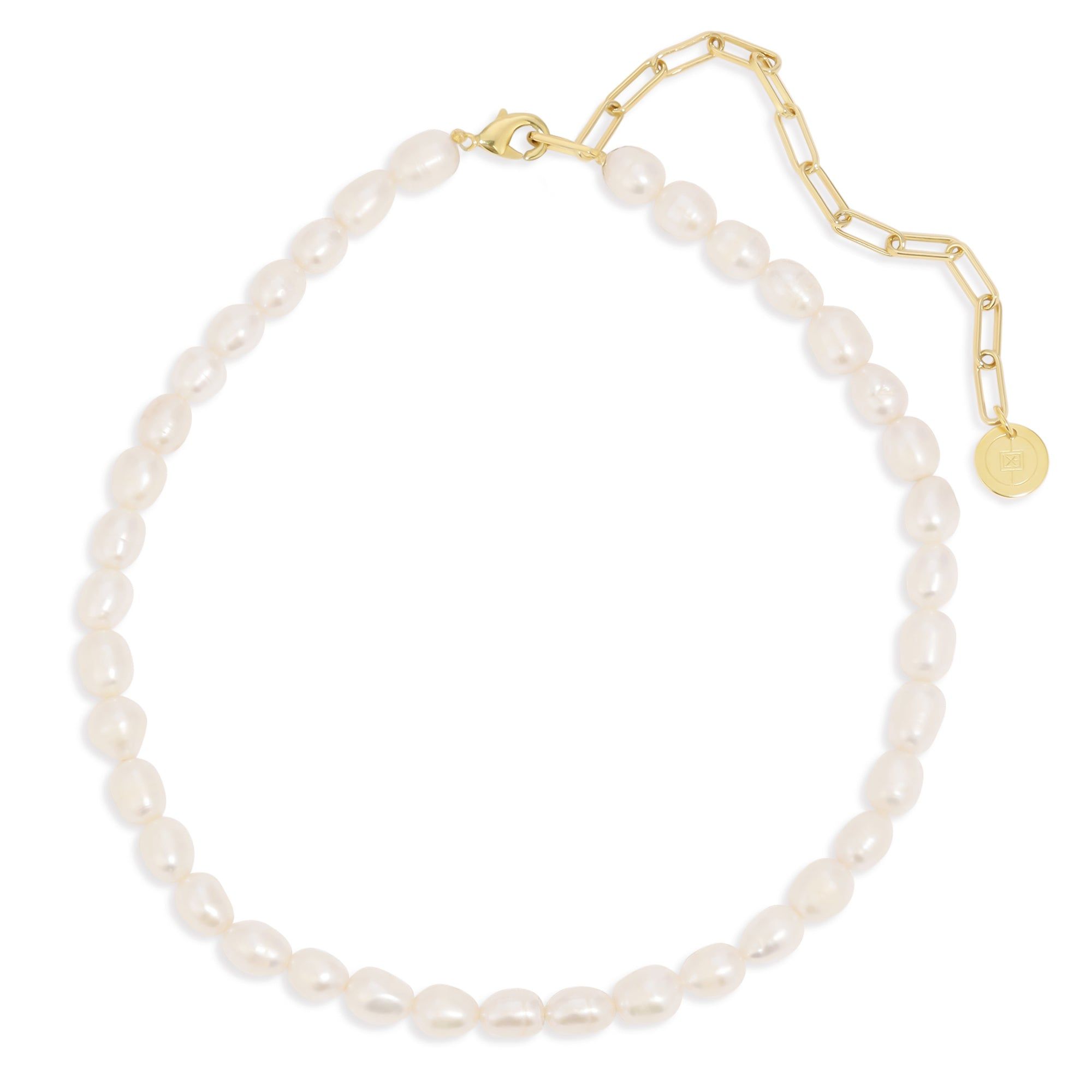 a bracelet with pearls and a gold charm