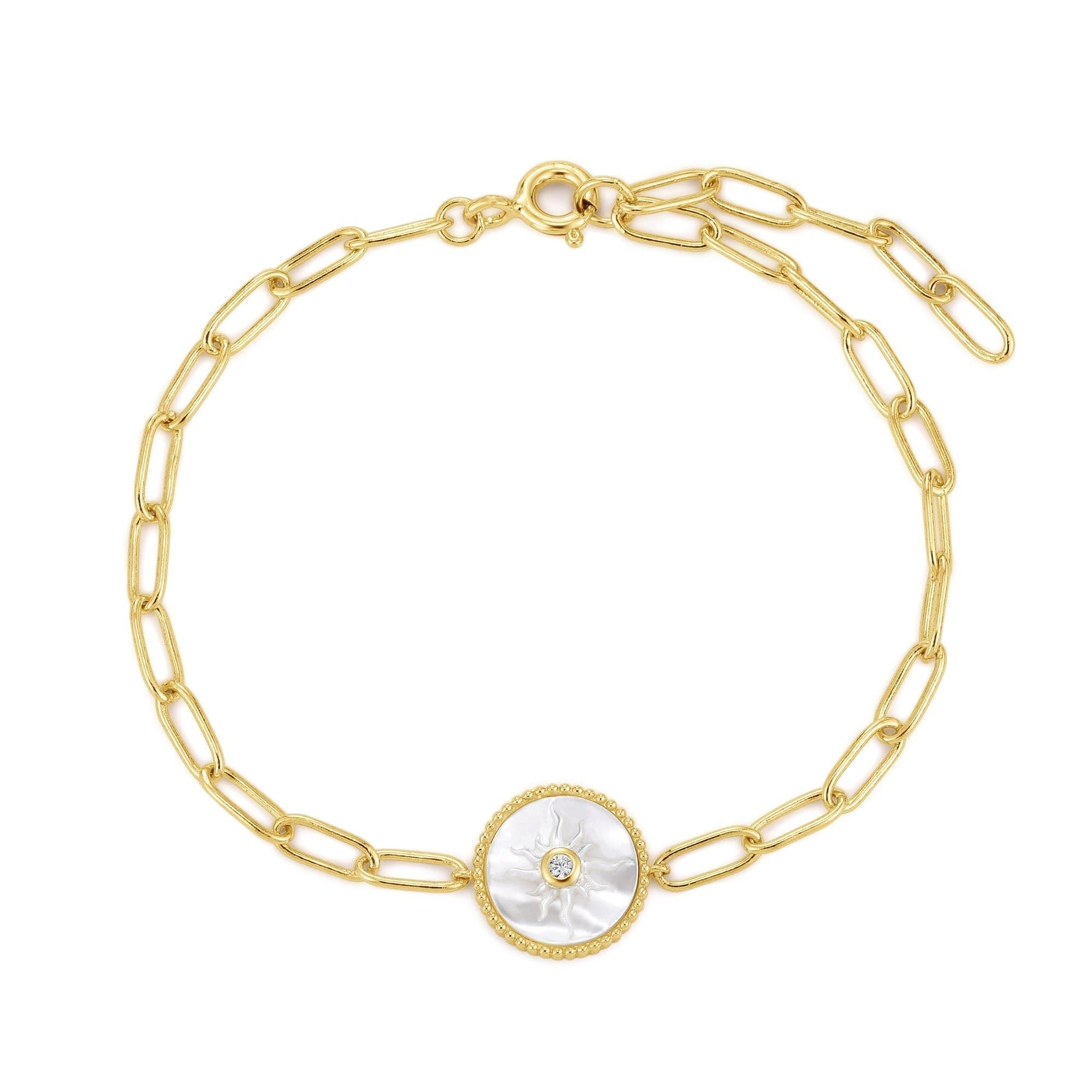 a gold bracelet with a mother of pearl in the center