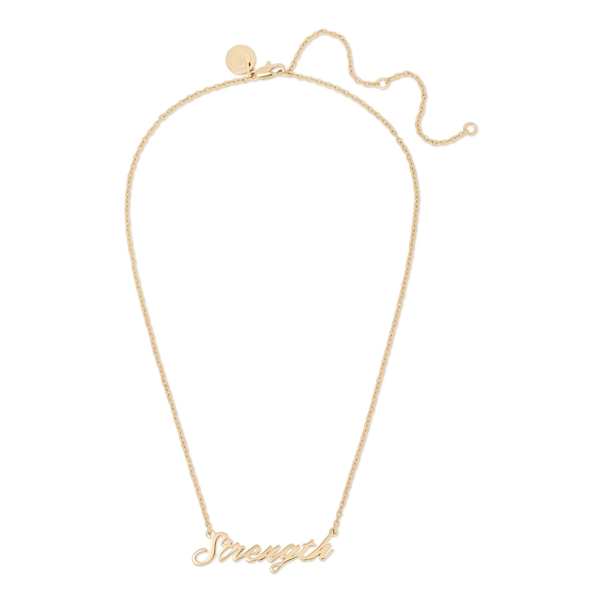 a gold necklace with a word that says, dreams