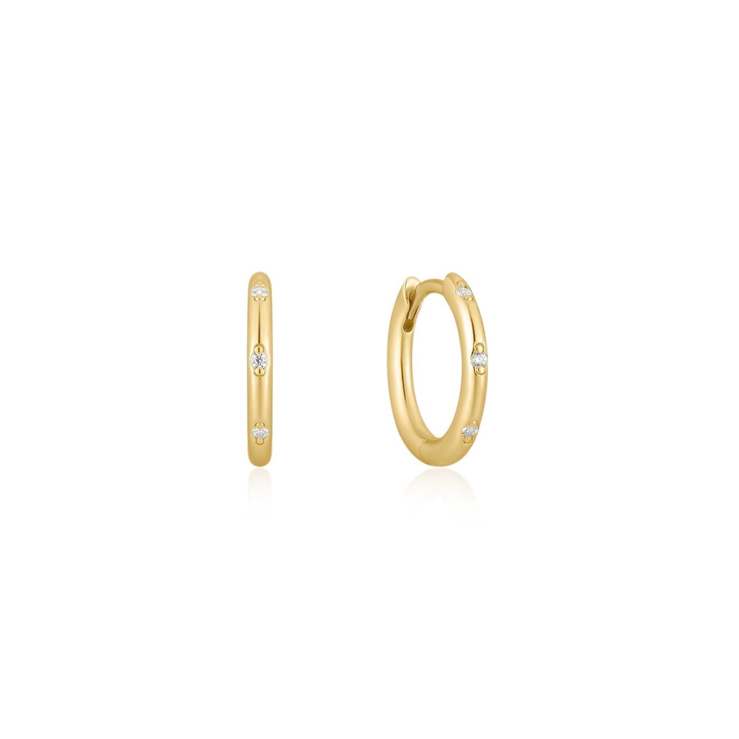 a pair of gold hoop earrings with diamonds