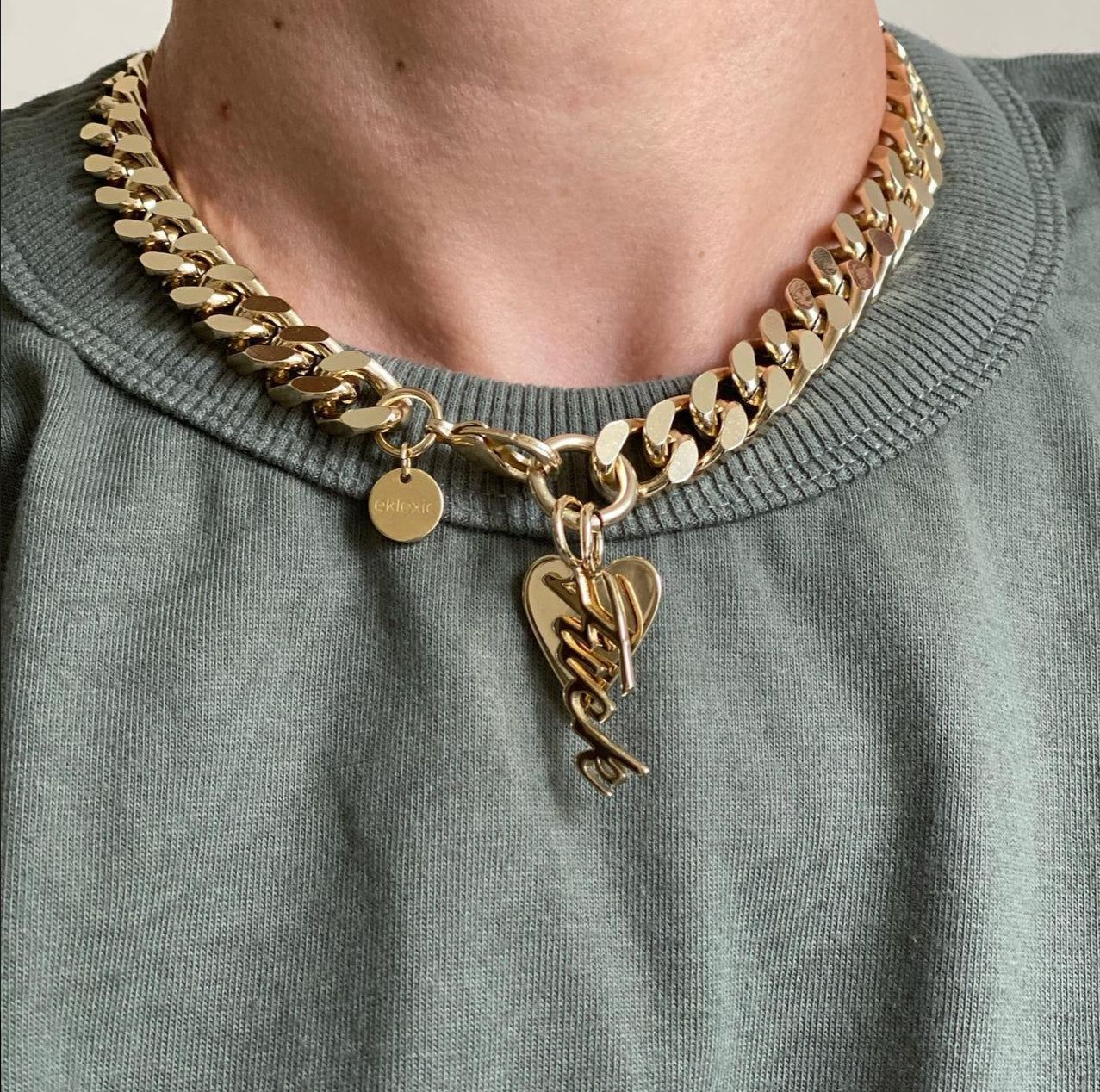 a close up of a person wearing a necklace