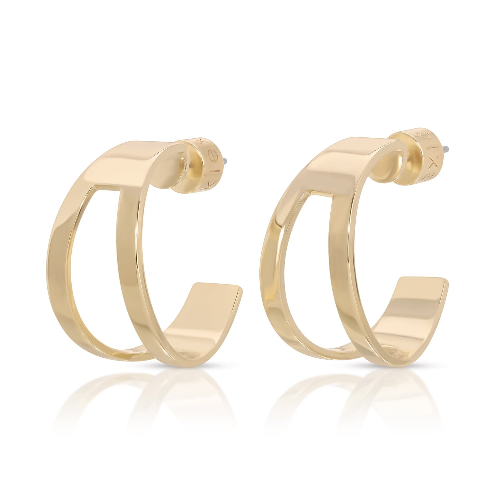 a pair of gold earrings on a white background