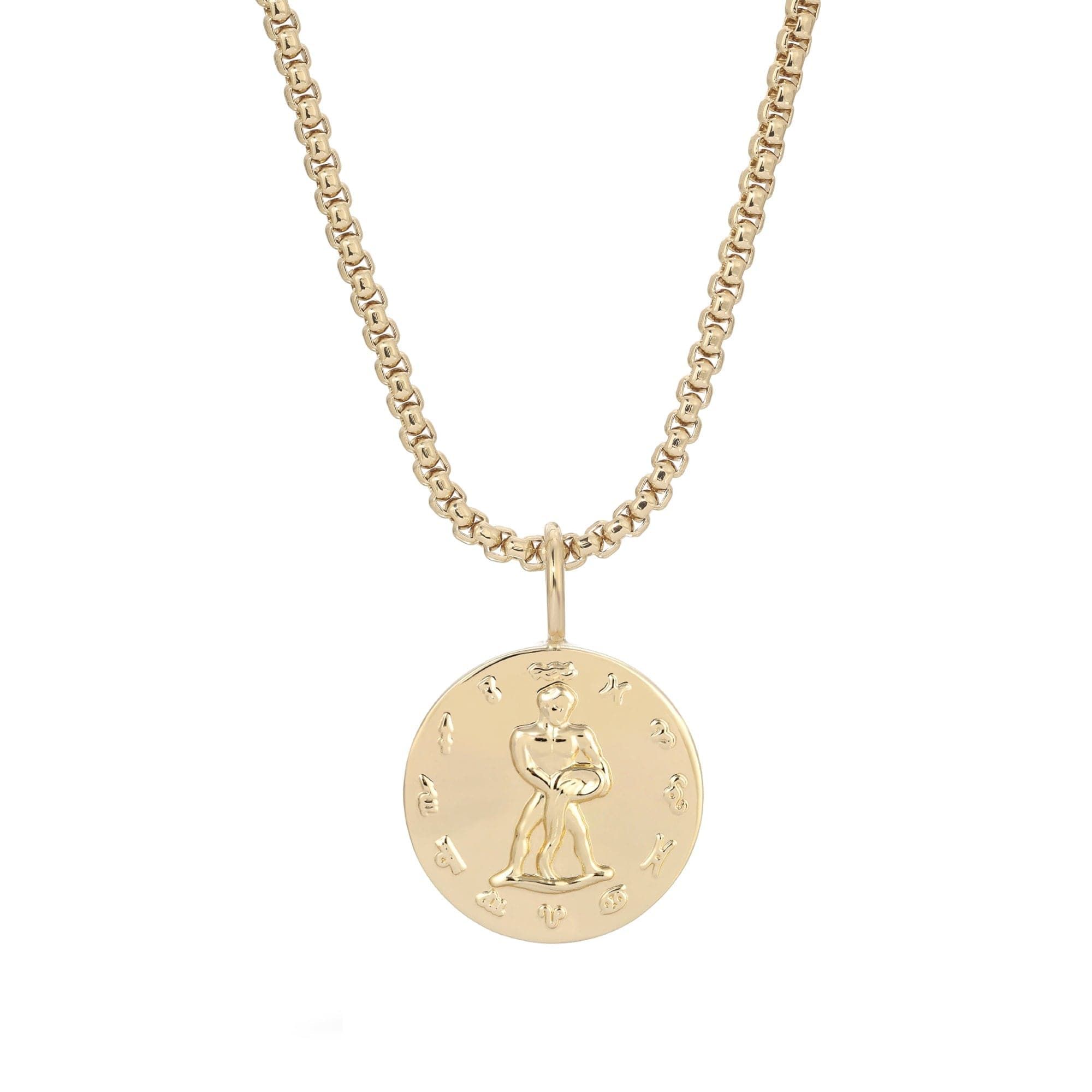 a gold necklace with a small child on it
