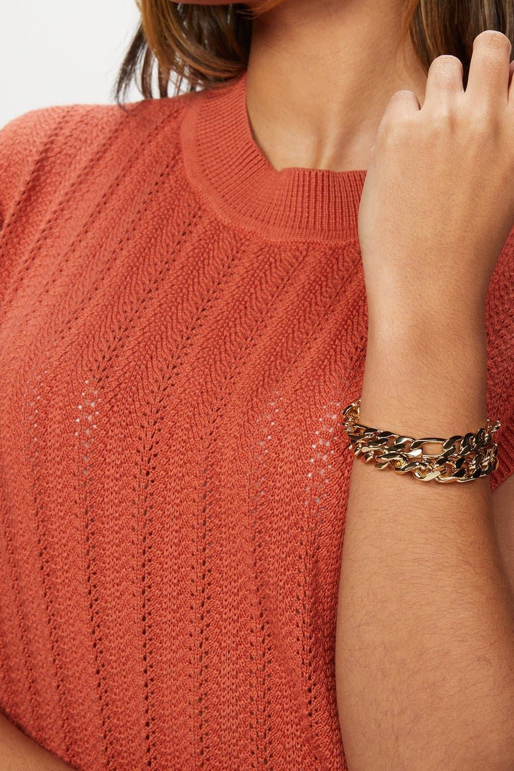 Coral knit top styled with Axel Bracelet featuring recycled brass figaro chain