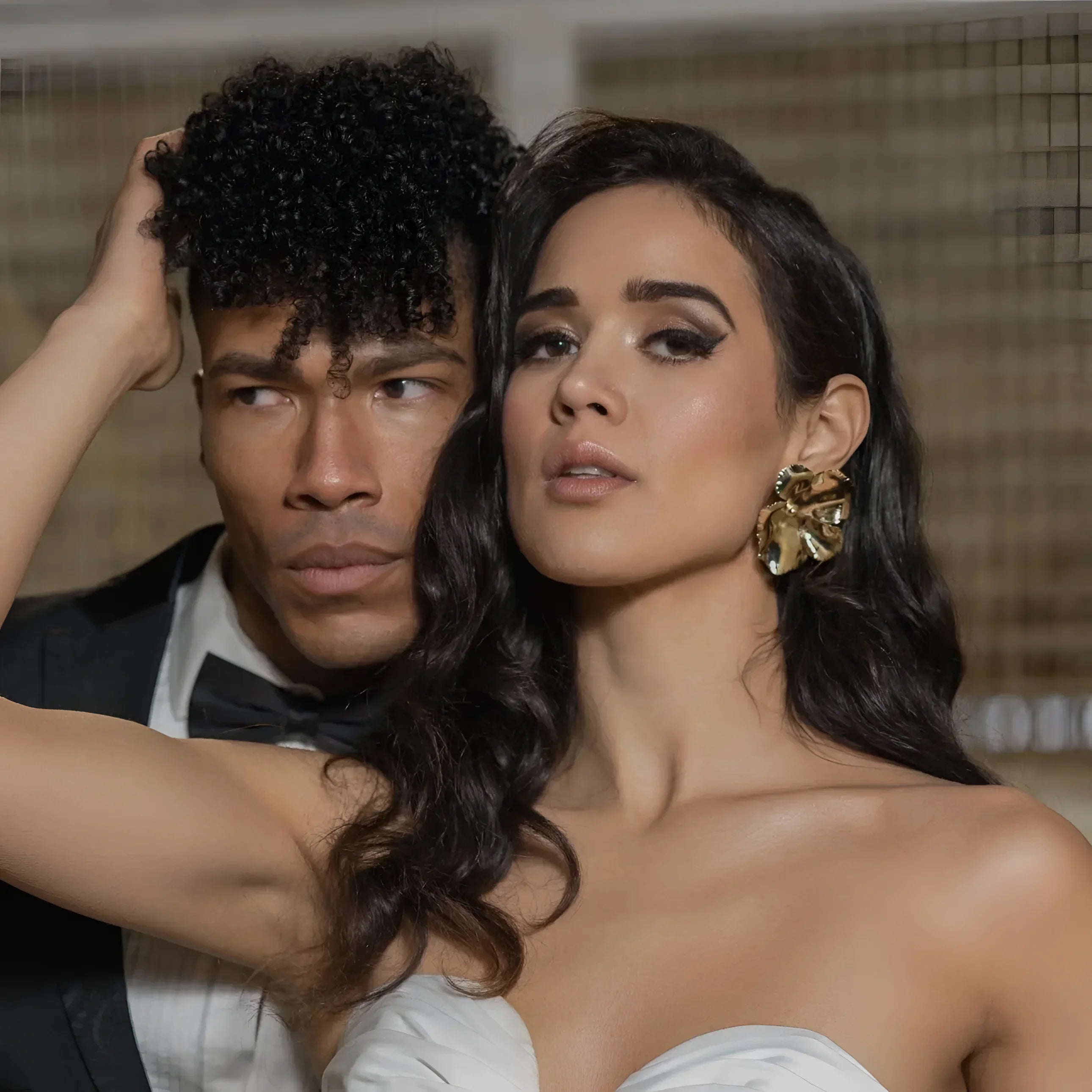 Glamorous couple showcasing elegant flower earrings with Bennett Earrings jewelry