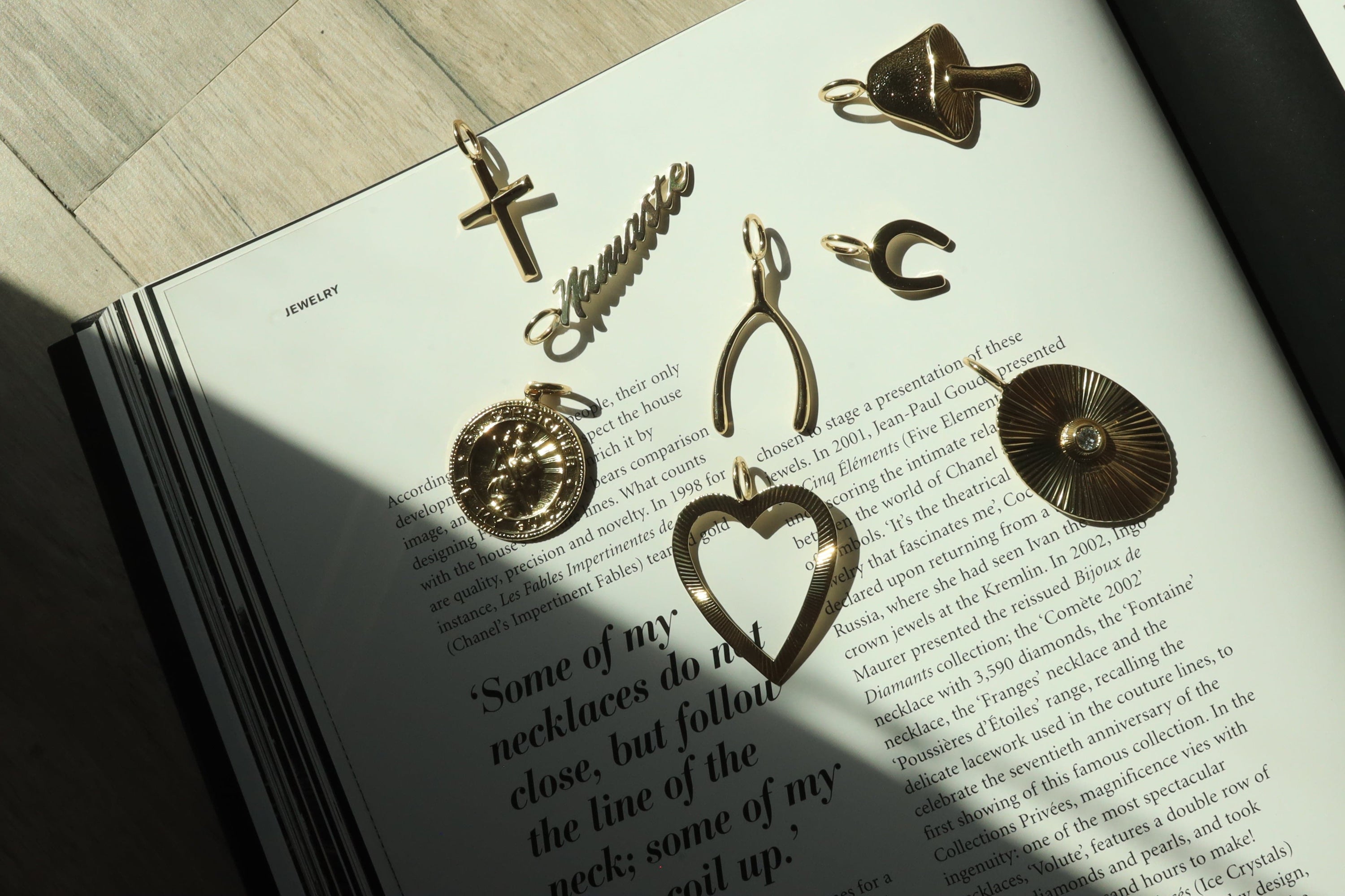 Collection of gold-colored Cross Pendants with recycled brass finishes and rhodium plating