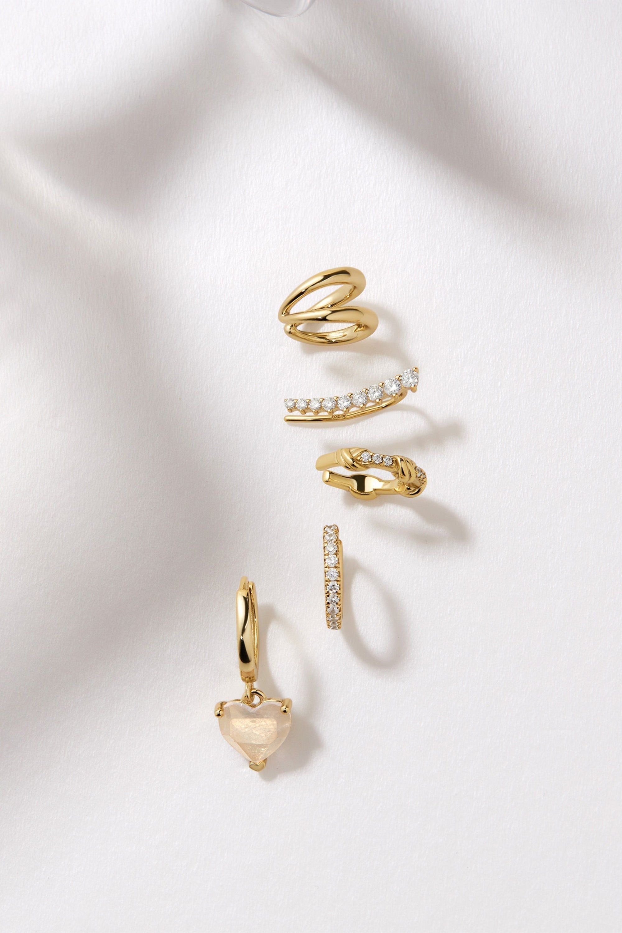 Gold-toned 14k gold plated earrings and ear cuffs featuring a stylish double ear cuff design