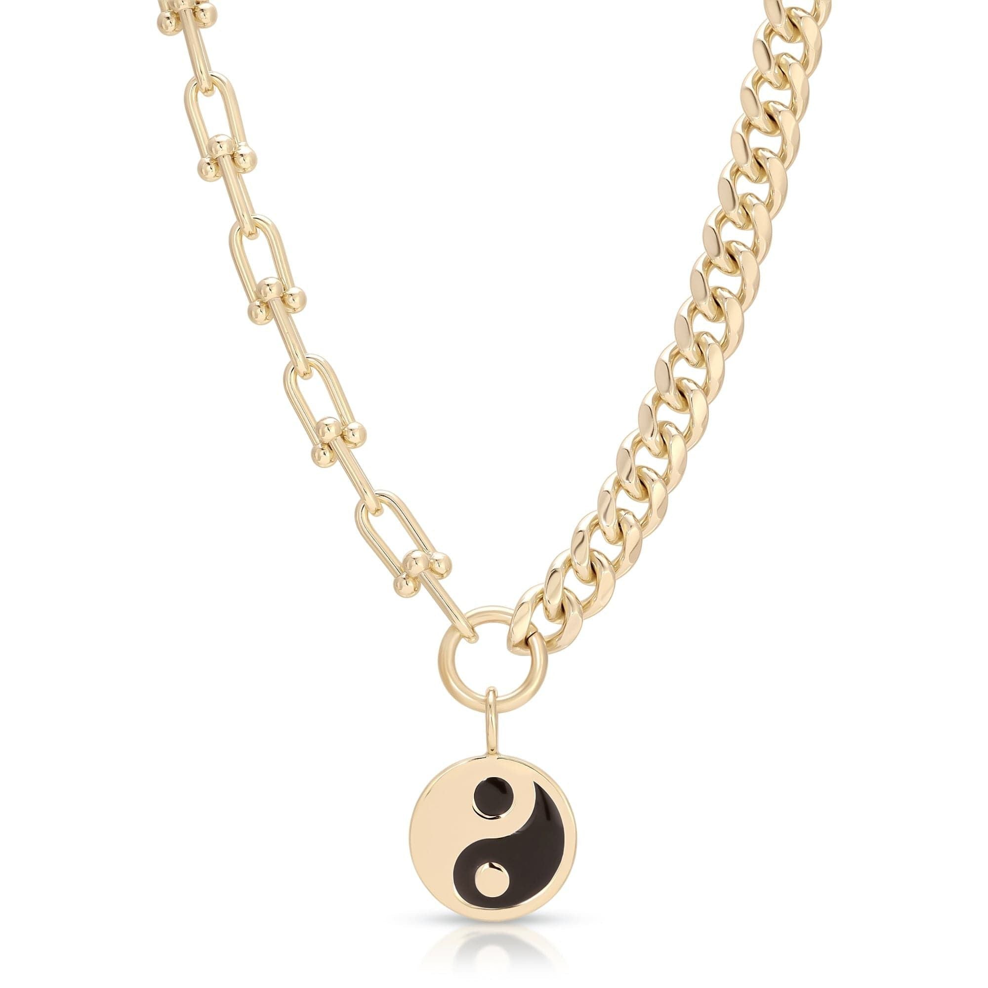 Gold dual chain necklace featuring a black enamel yin yang pendant design