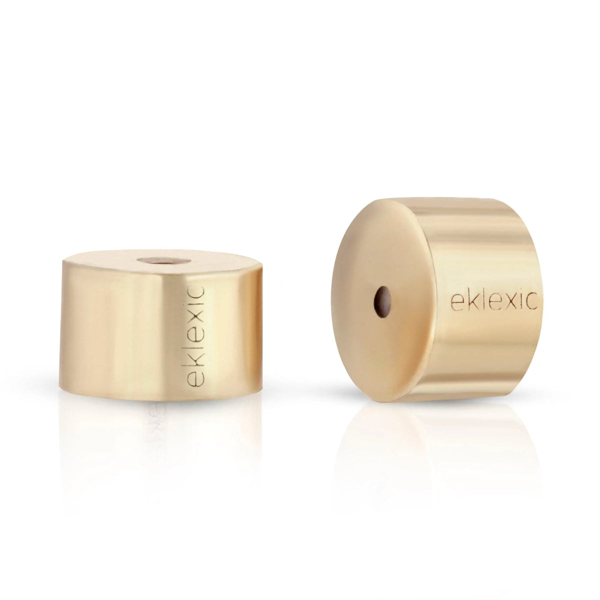 Gold-colored cylindrical Eklexic Earring Backs for secure jewelry fit