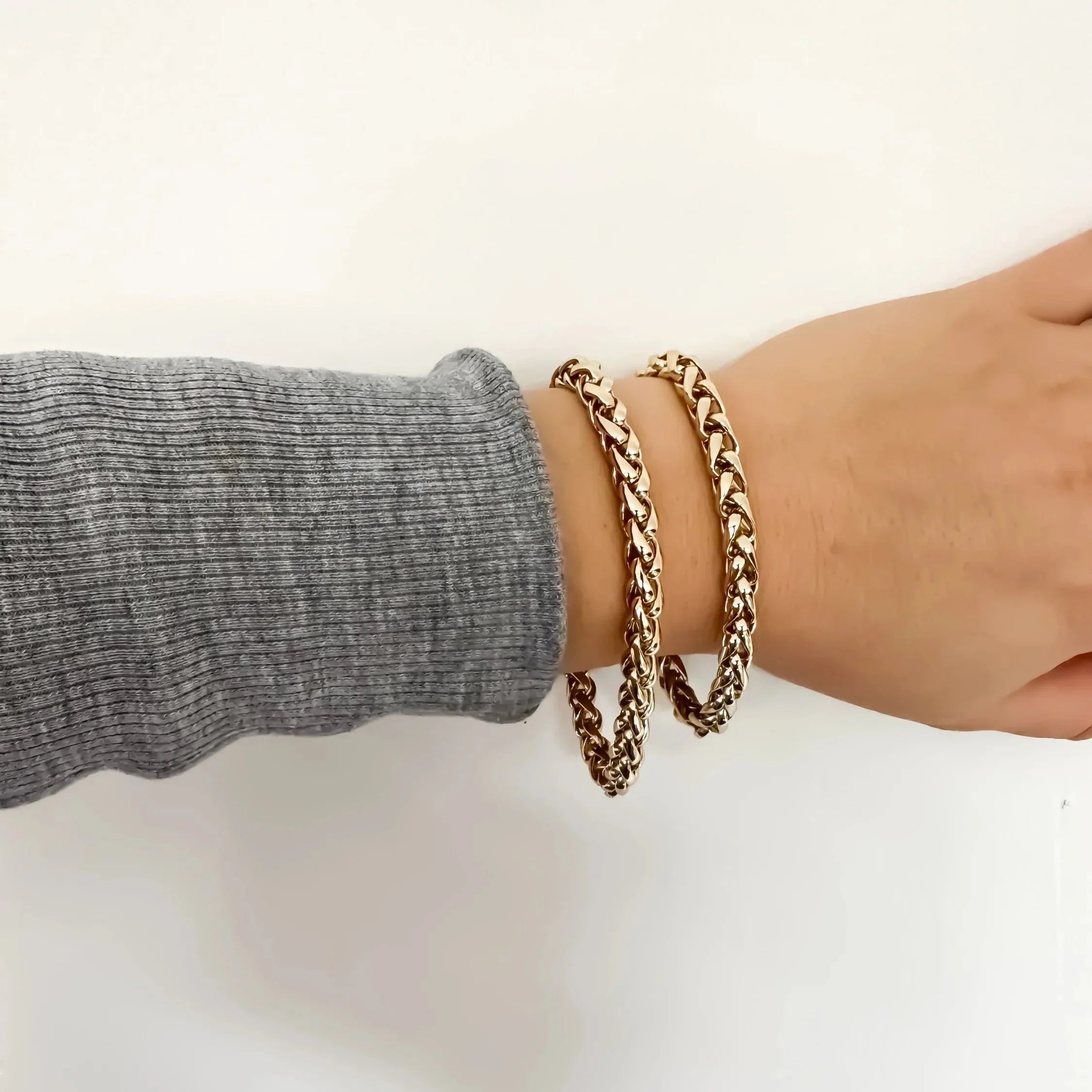 Esmé Bracelet featuring two stylish gold braided bracelets for a chic look