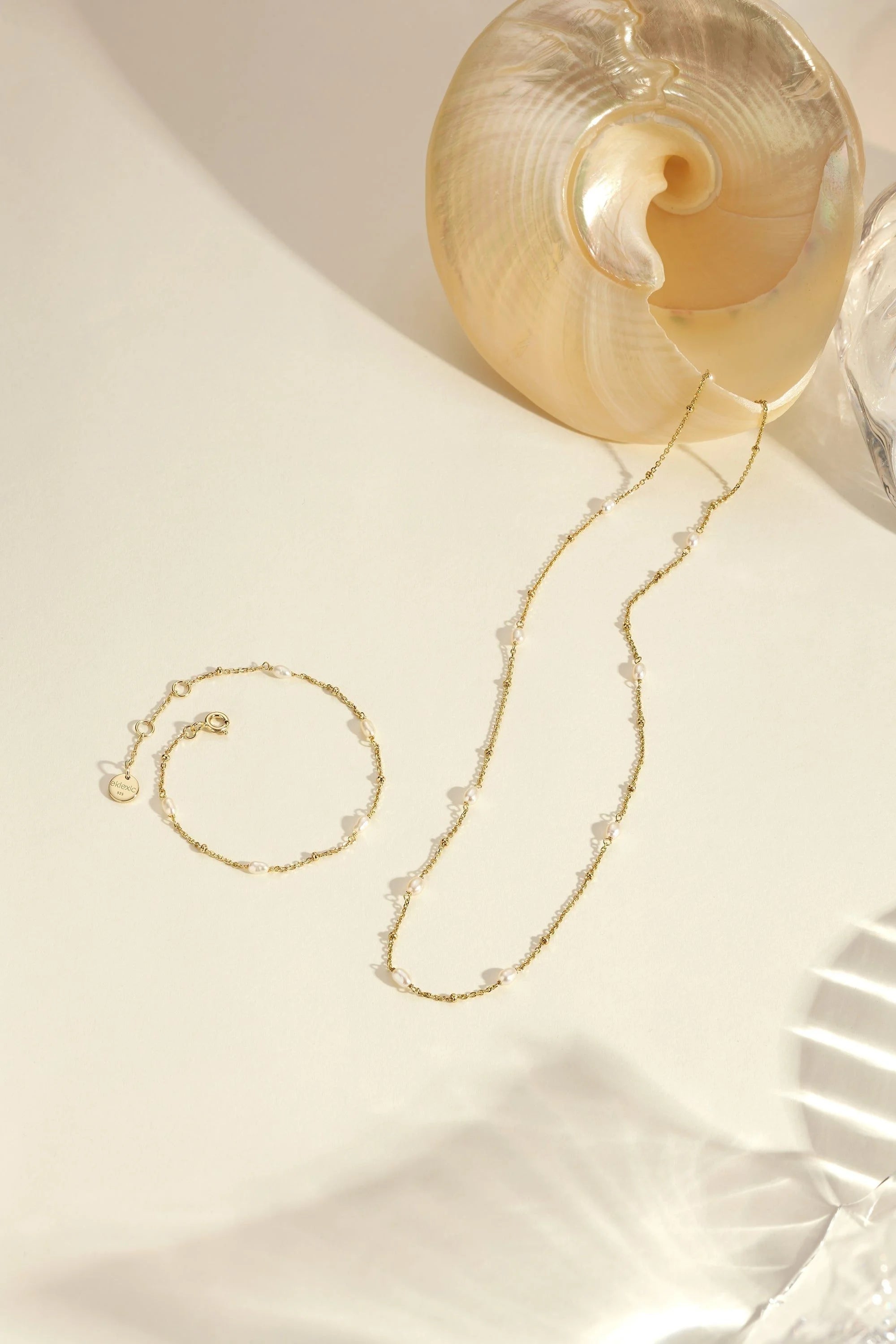 Gold necklace and bracelet with pearl accents from Micro Alternating Pearl Bead Bracelet