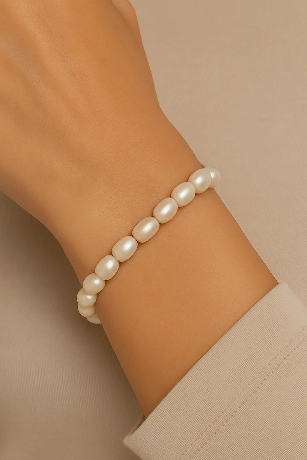 Woman’s wrist wearing a beautiful Pearl Bead Bracelet with elegant pearls