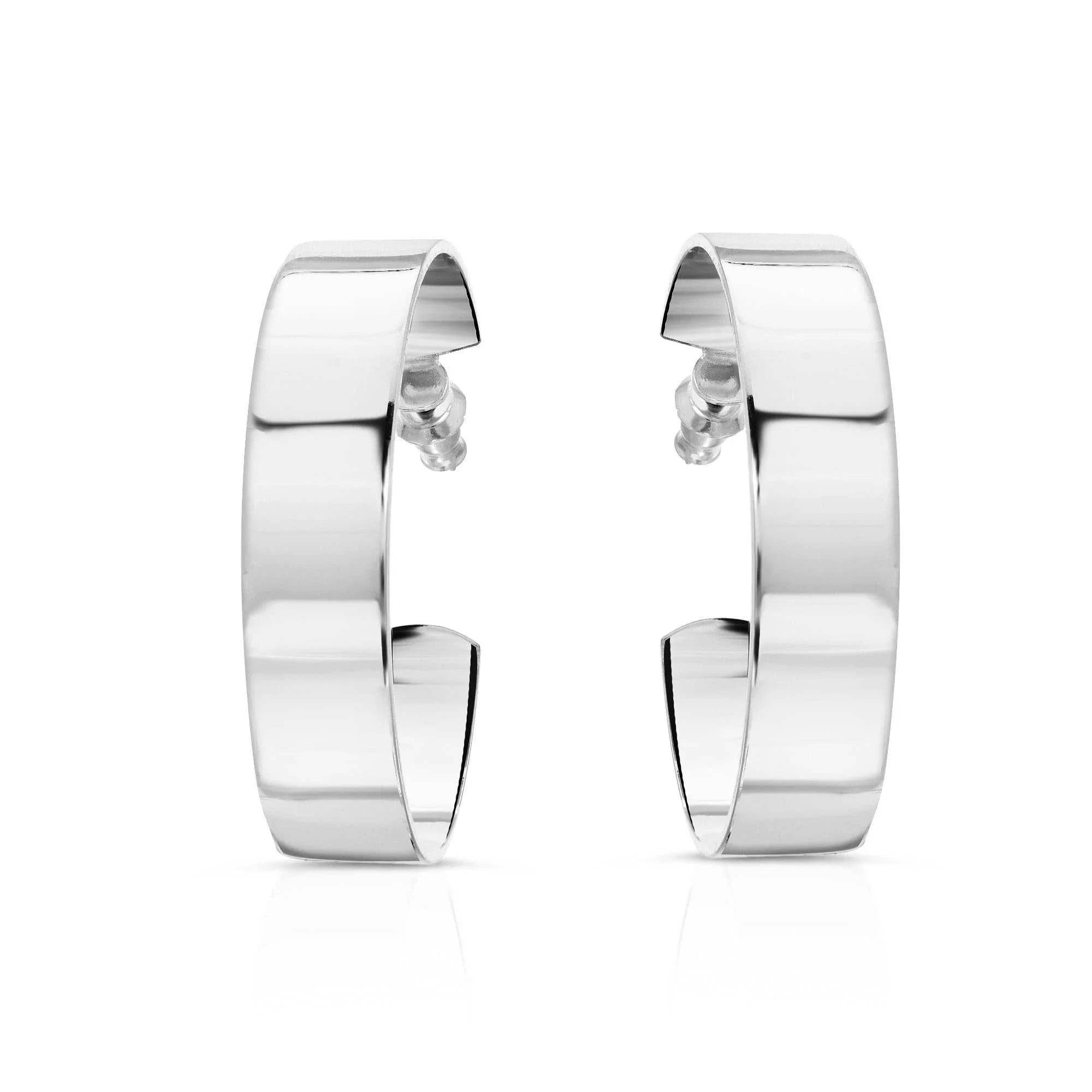 Silver hoop earrings shown on a model for 1.5 Skylar Hoops product