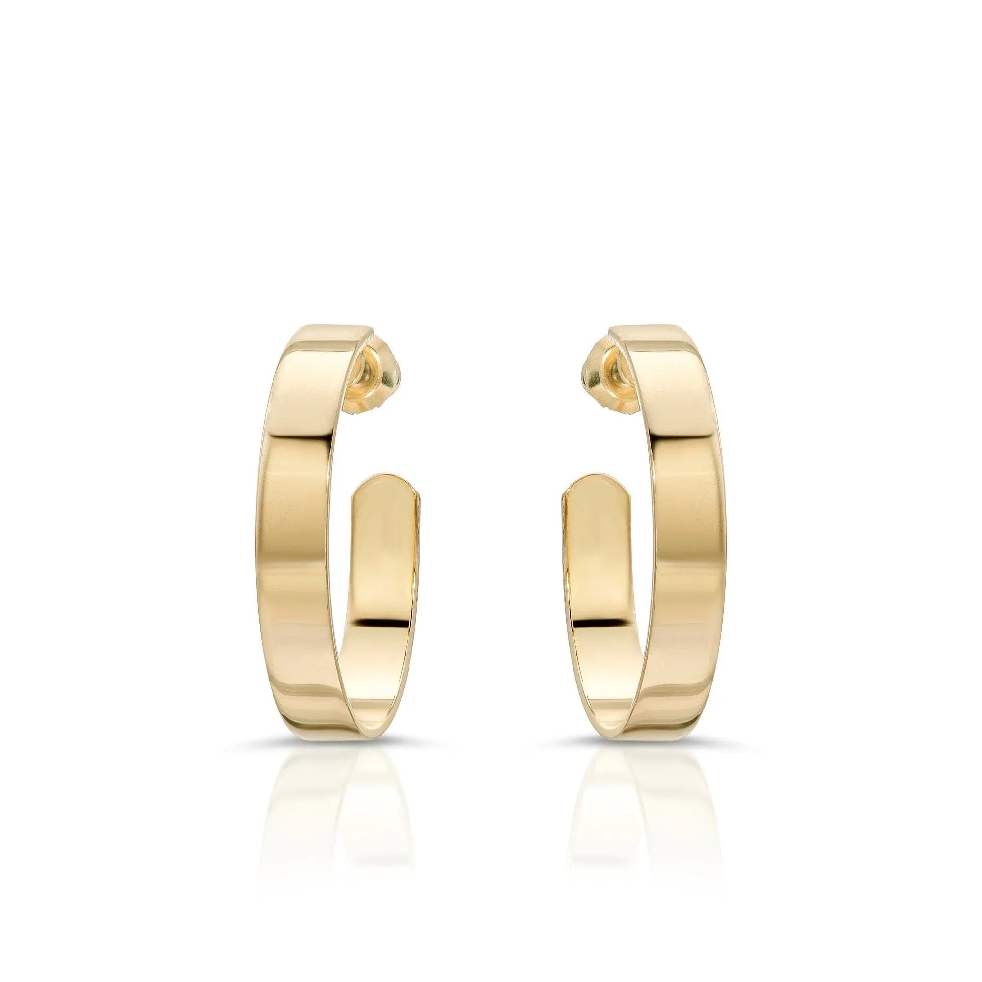 Shiny gold 1 inch Isla Hoops earrings showing off a cute and trendy style