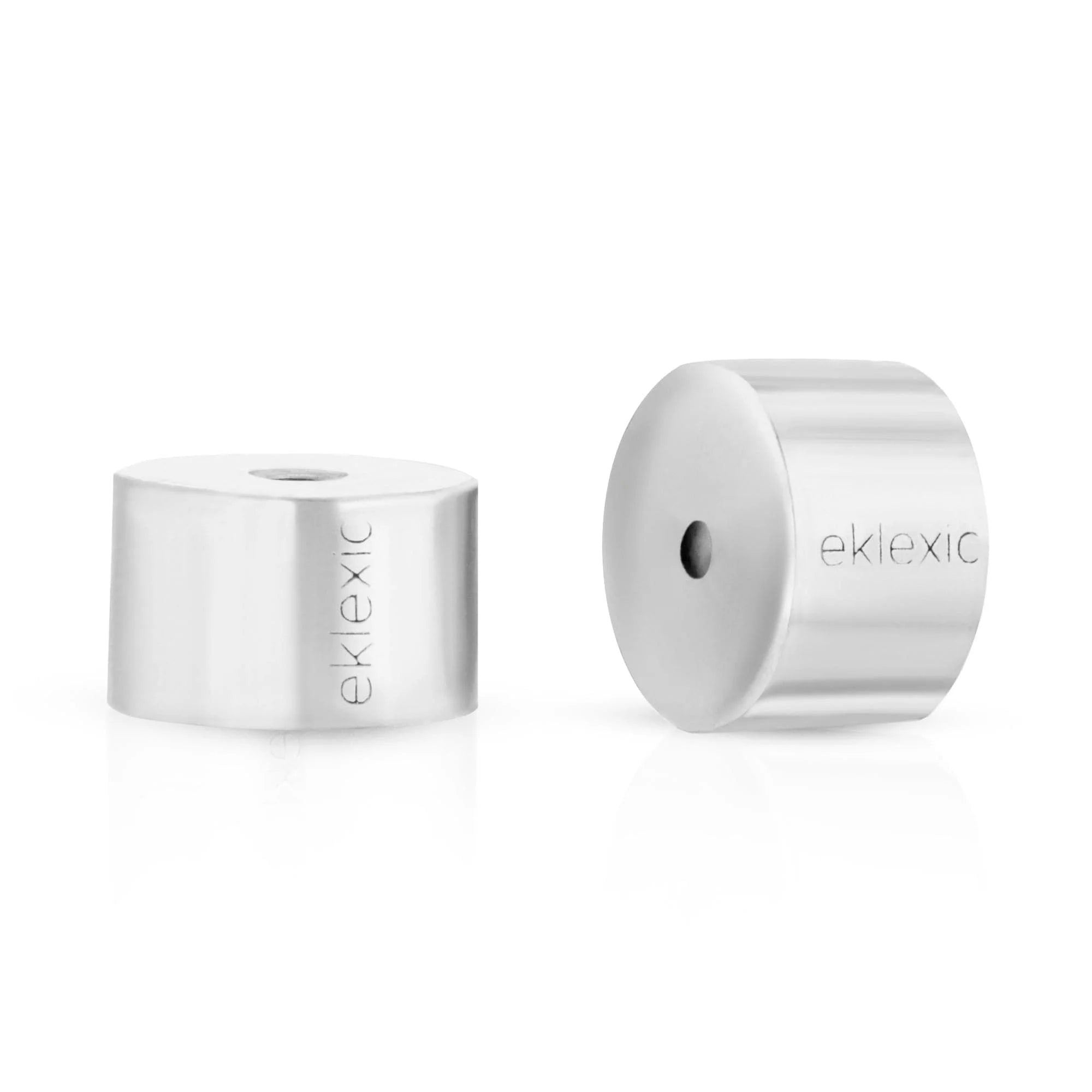 Two silver cylindrical Eklexic Earring Backs shown close-up for secure piercings