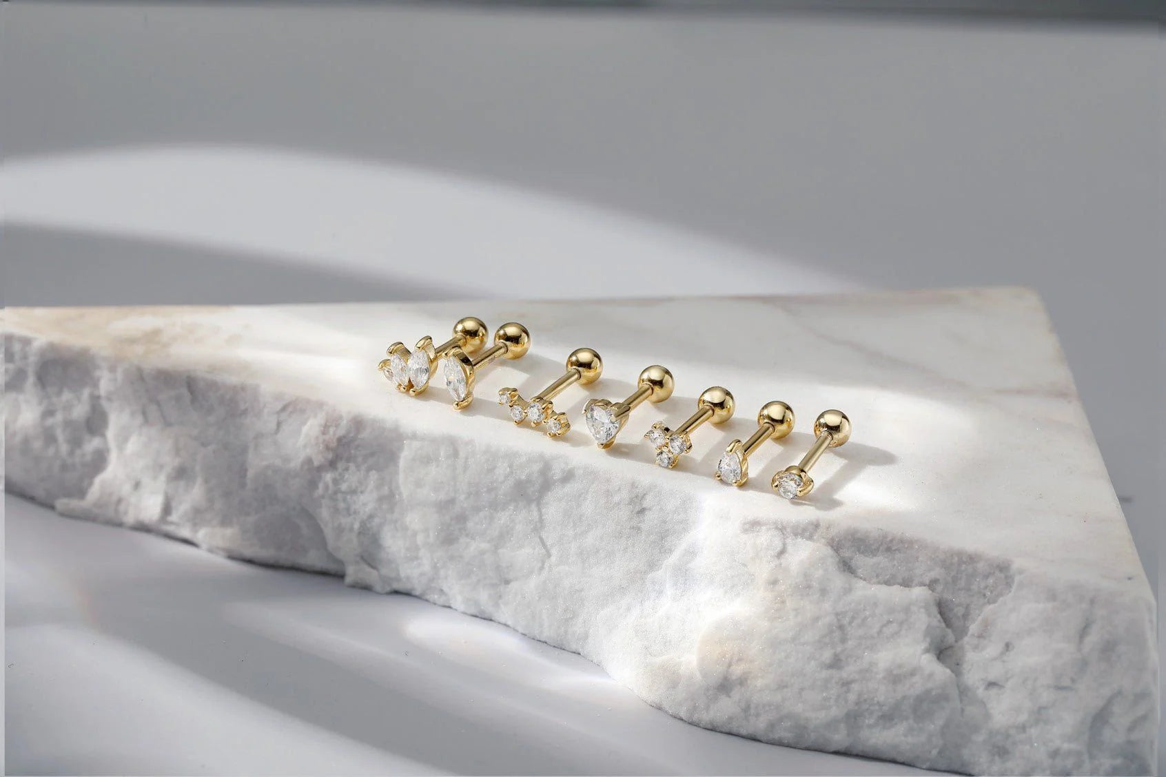 Gold-toned Heart CZ Stud Earrings with clear sparkling gemstones perfect for any look