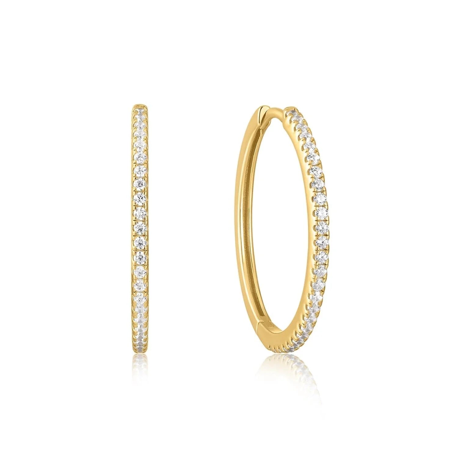 Gold hoop earrings with embedded crystals in Medium CZ Huggie Hoop Earrings style
