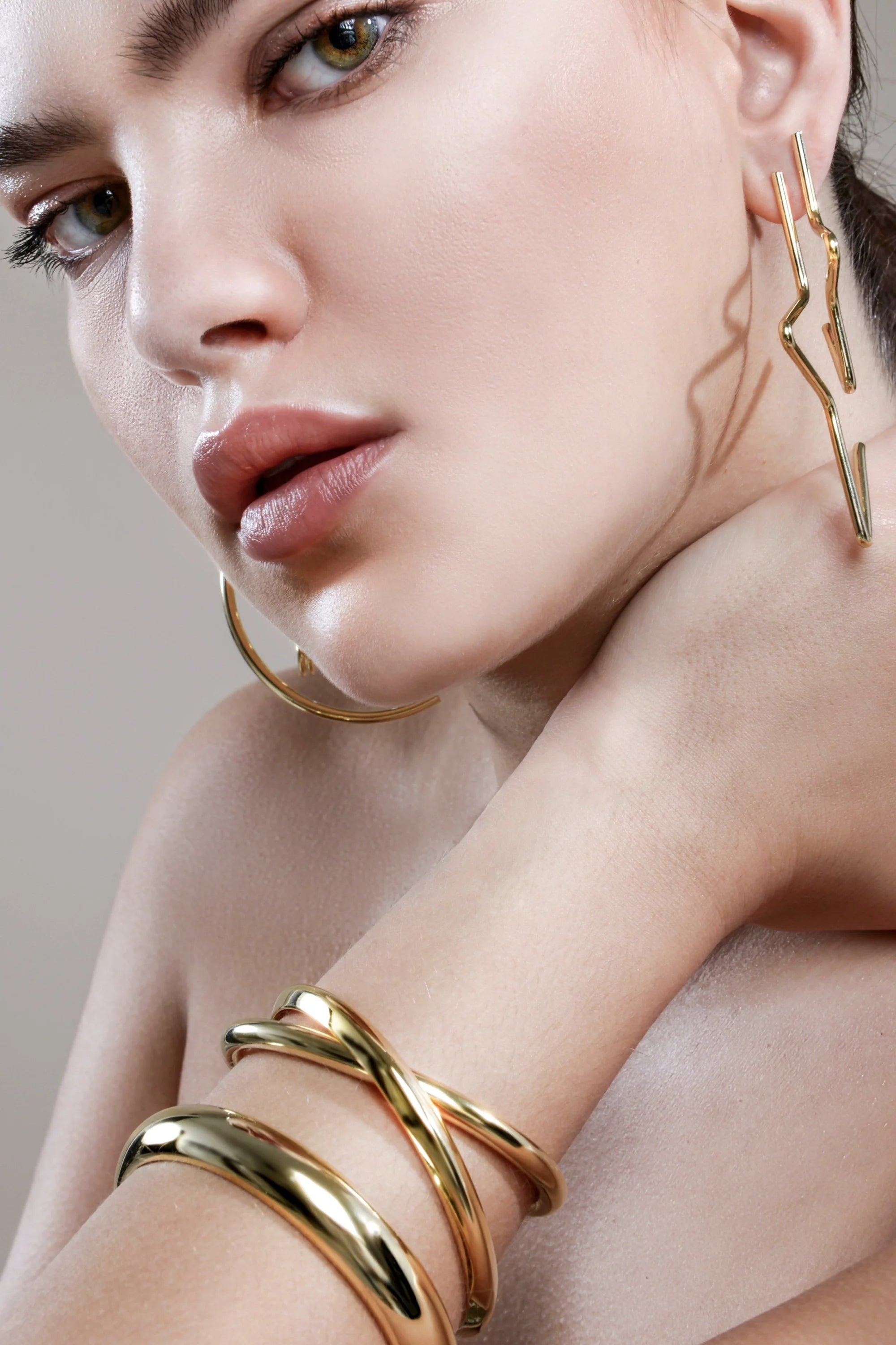 Woman wearing stunning gold Large 1/2 Star Earrings showcasing stylish jewelry