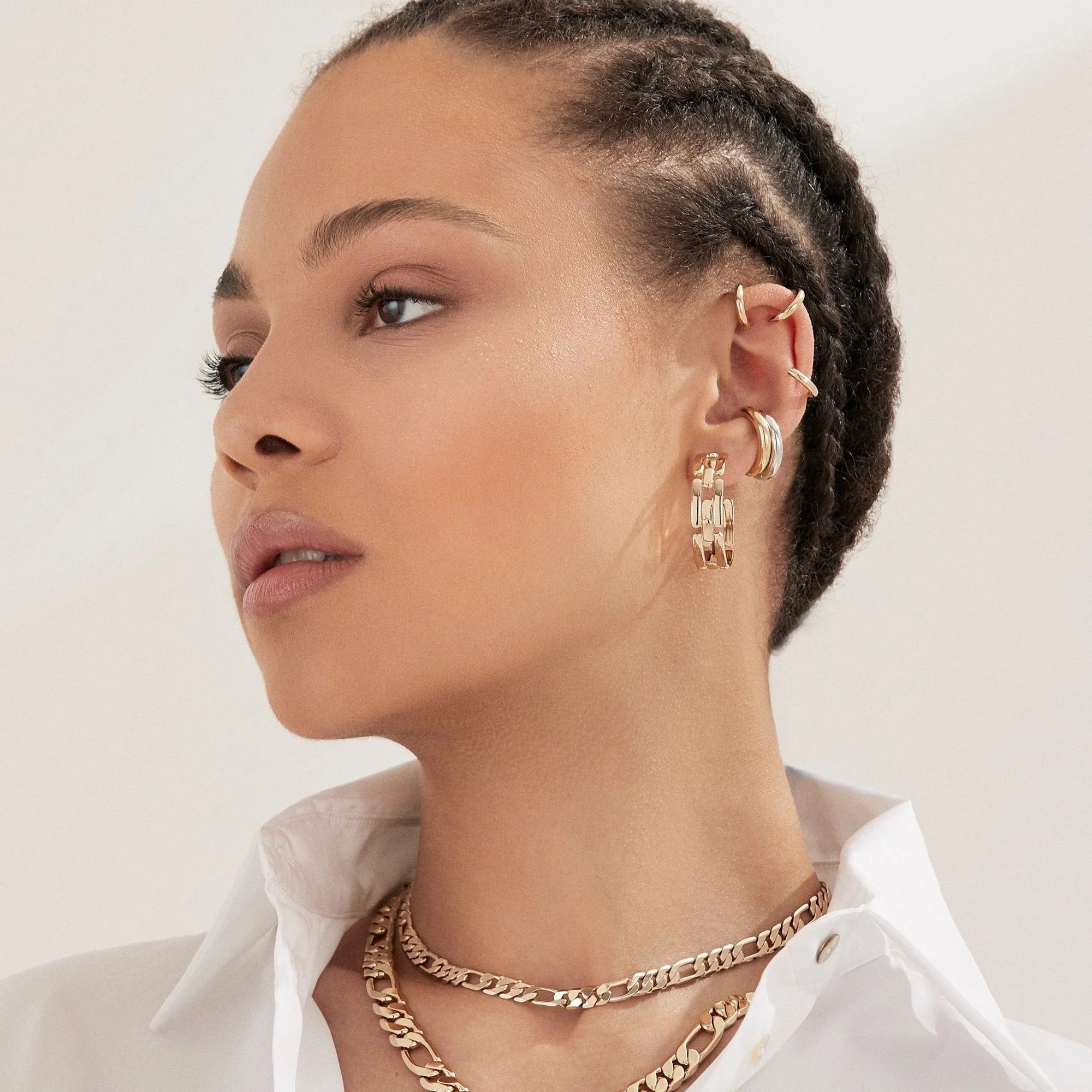 Woman wearing Gold Jewelry Lisa Ear Cuff looking chic and trendy