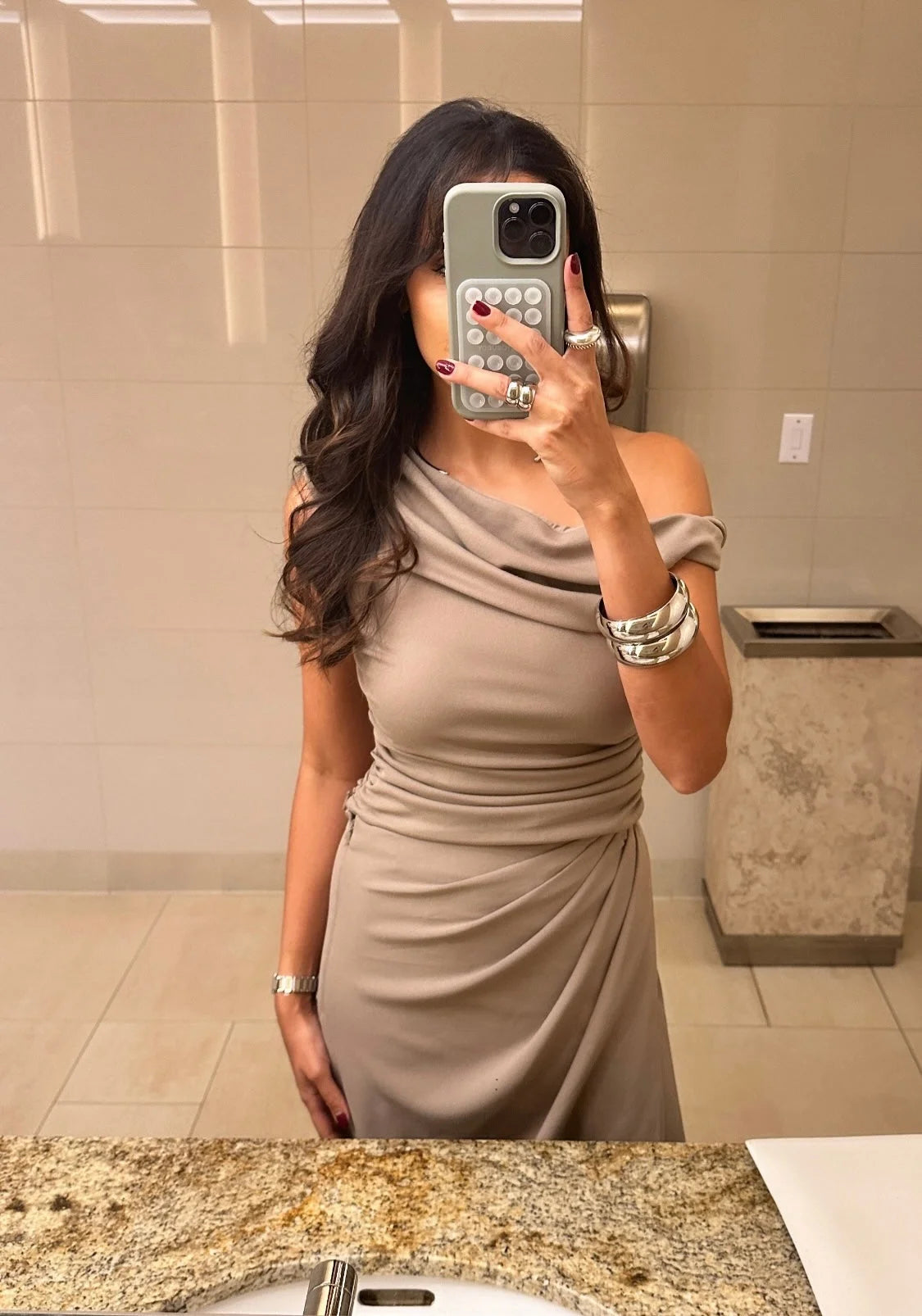 Taupe draped dress paired with the Medium Athena Bangle for a chic look